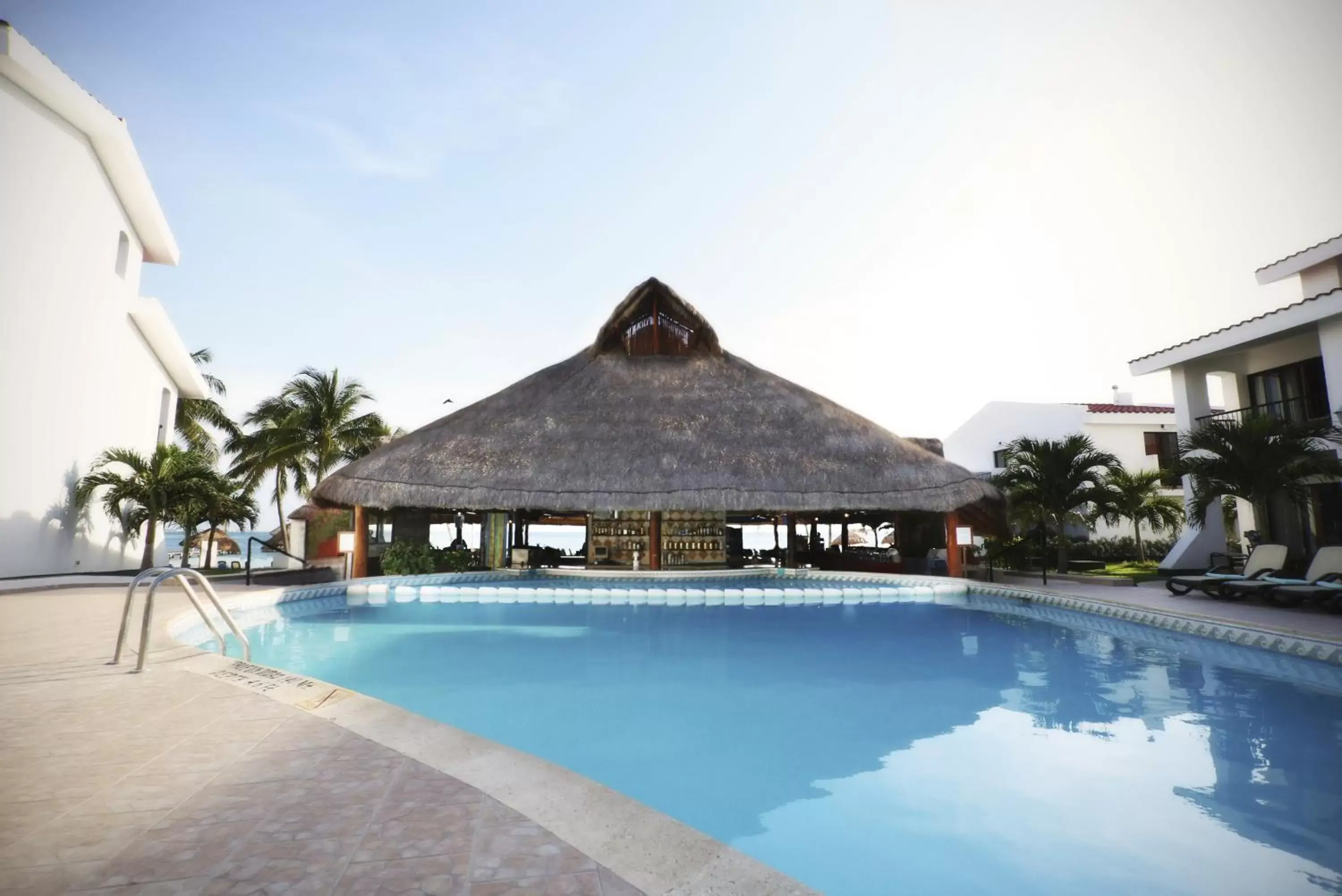 Lounge or bar, Swimming Pool in The Villas at The Royal Cancun - All Suites Resort