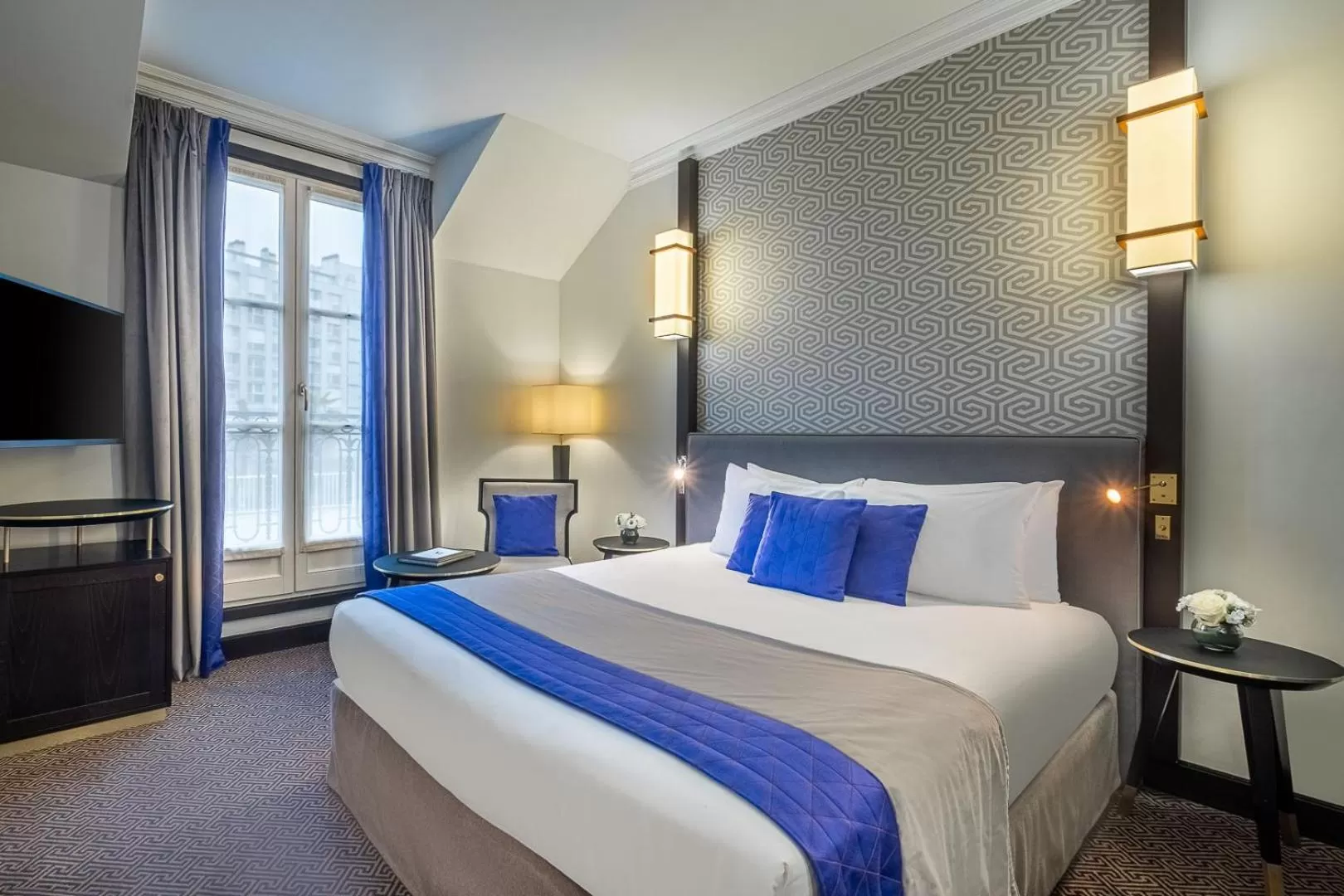 Bed in Hôtel Le Marquis by Inwood Hotels