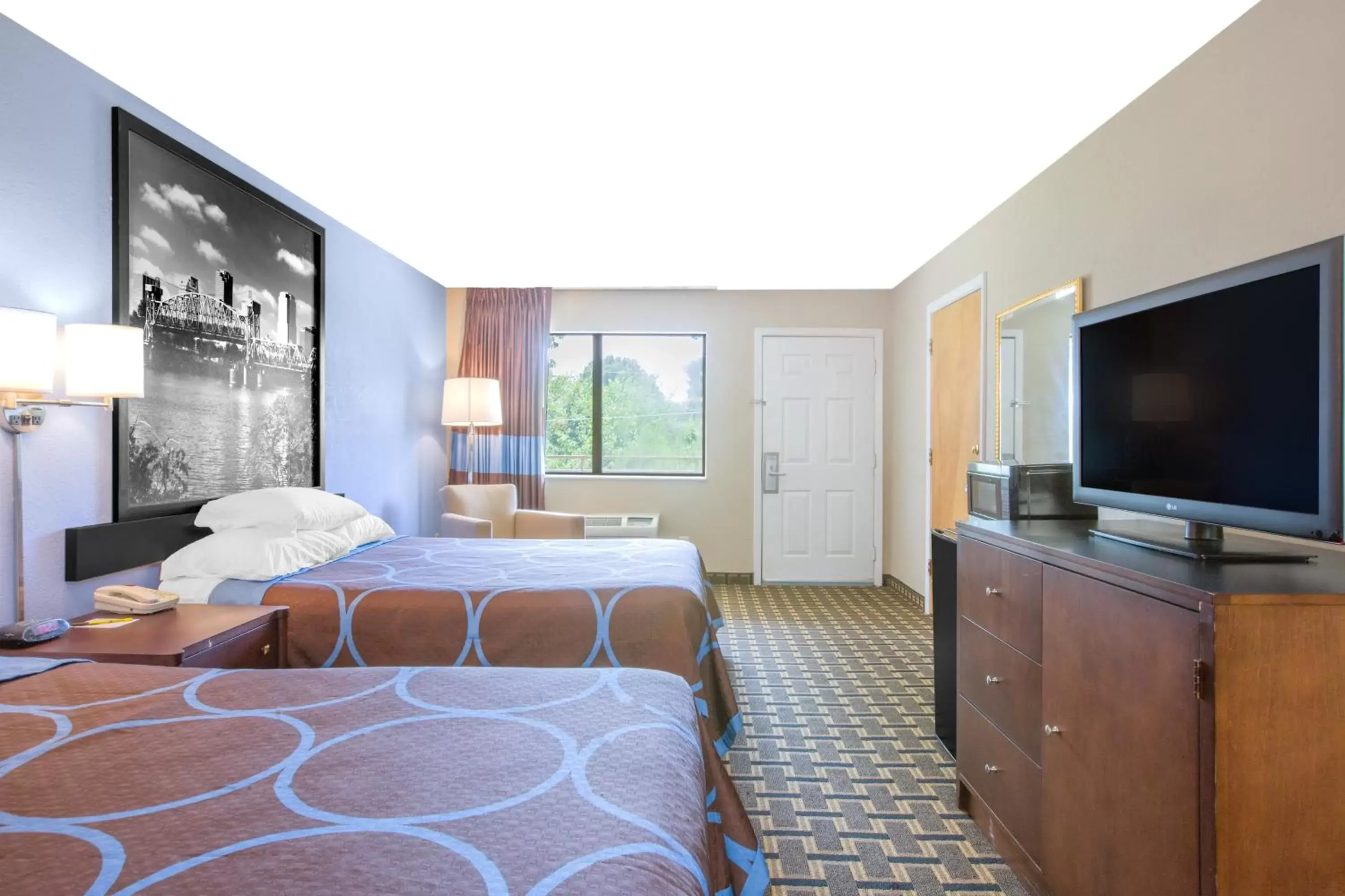 Photo of the whole room, Bed in Super 8 by Wyndham Brinkley Photo of the whole room, Bed in Super 8 by Wyndham Brinkley