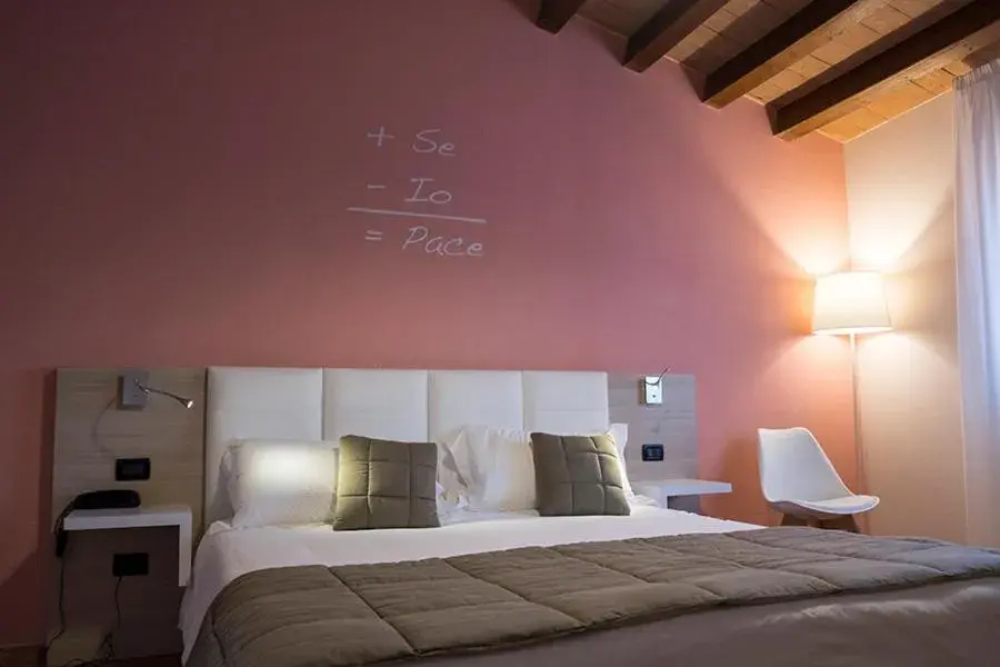 Bed in Relais Madonna di Campagna