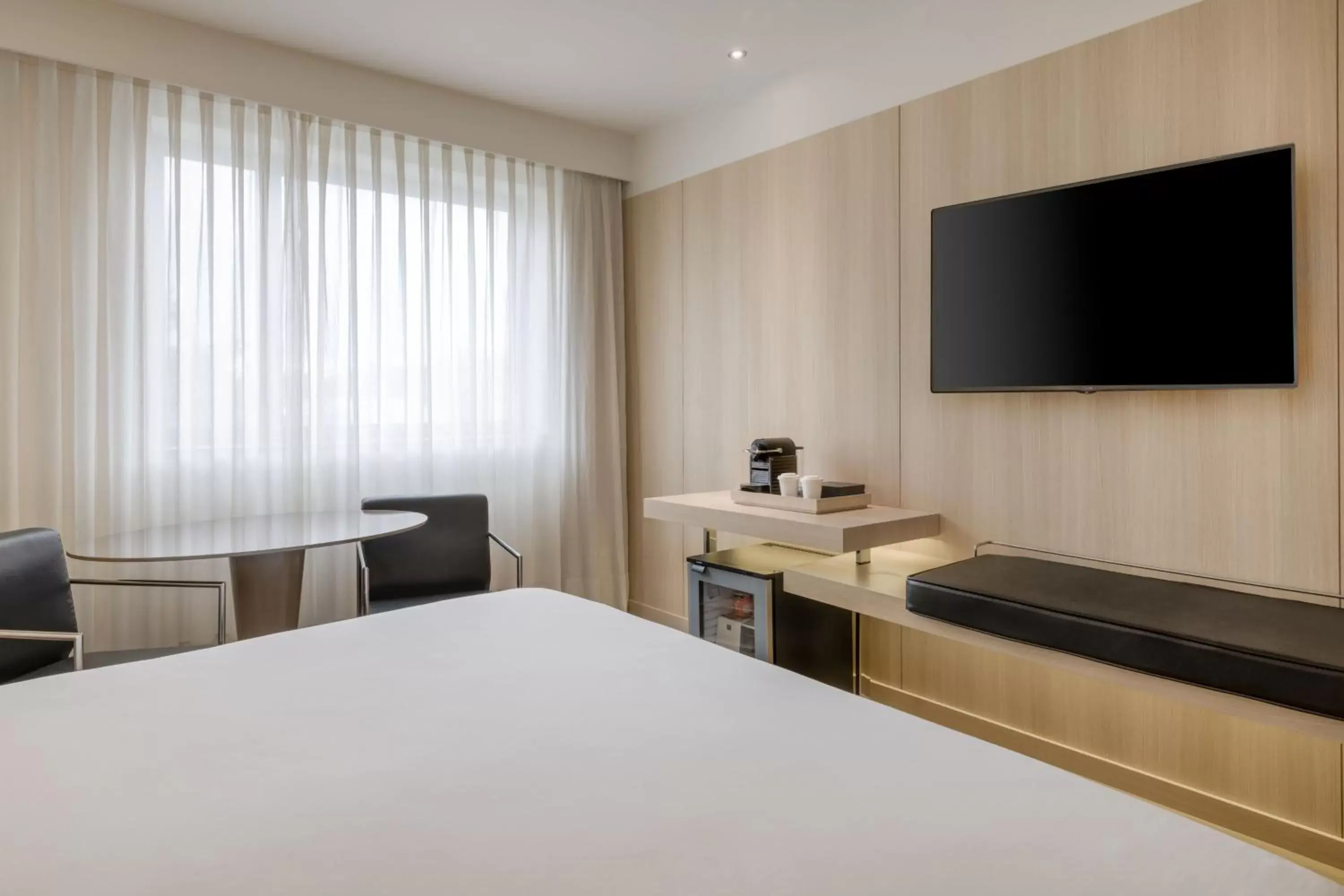 Photo of the whole room, TV/Entertainment Center in AC Hotel Córdoba by Marriott