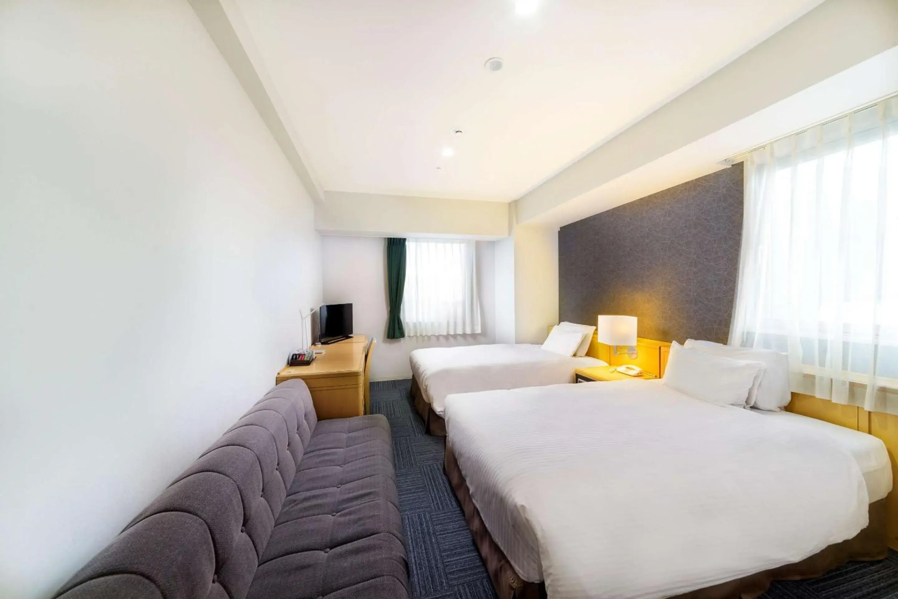 Bedroom in SureStay Plus Hotel by Best Western Shin-Osaka