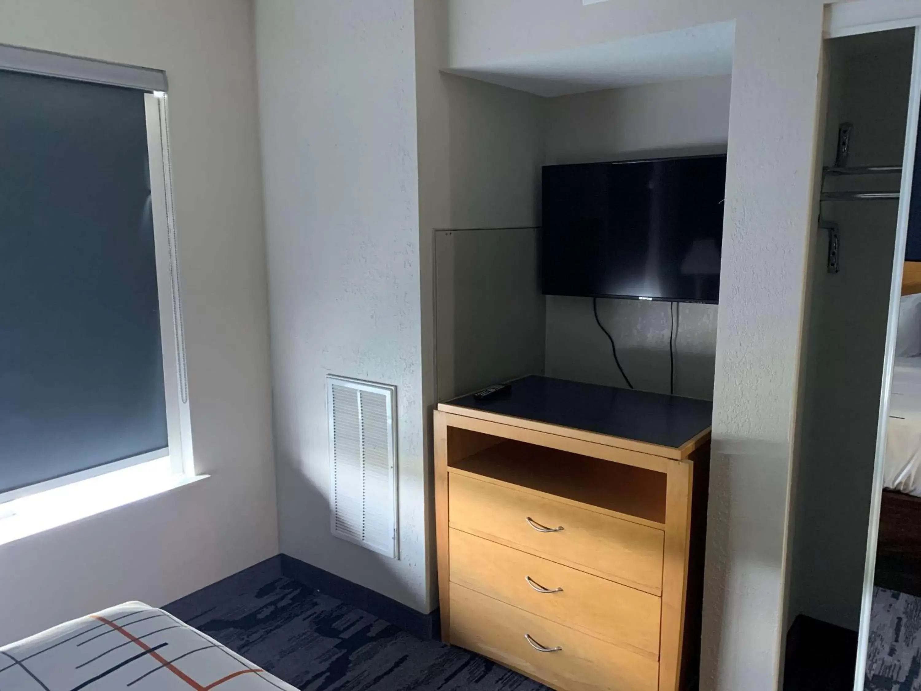 Photo of the whole room, TV/Entertainment Center in SureStay Plus by Best Western San Antonio Fort Sam Houston