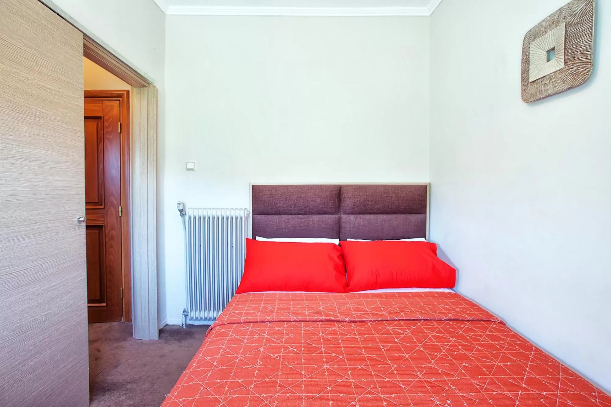 Property building, Bed in Anastassiou Hotel - Bike and motorcycle friendly hotel