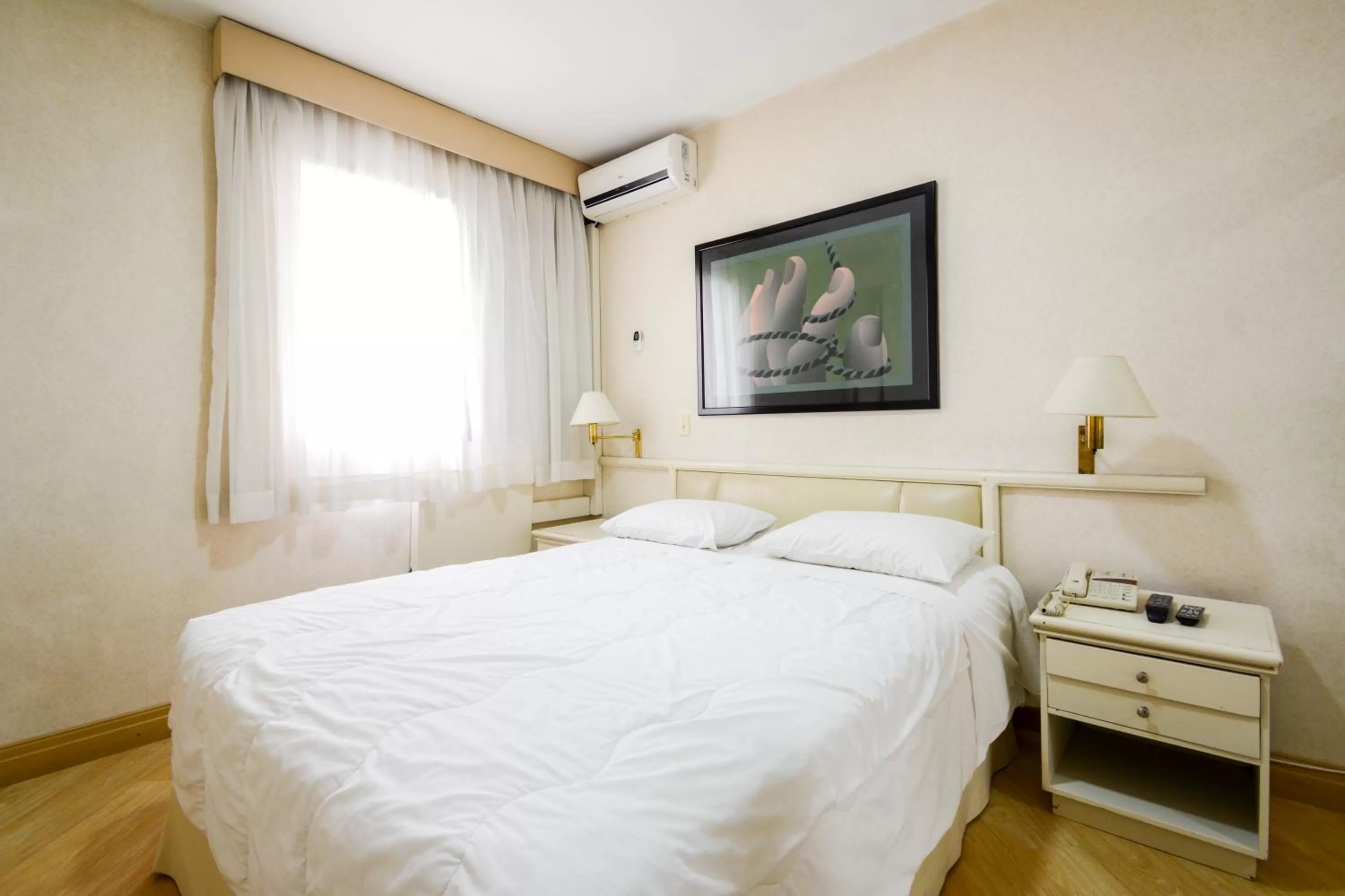 Bed in Wall Street Apartments by BnbHost