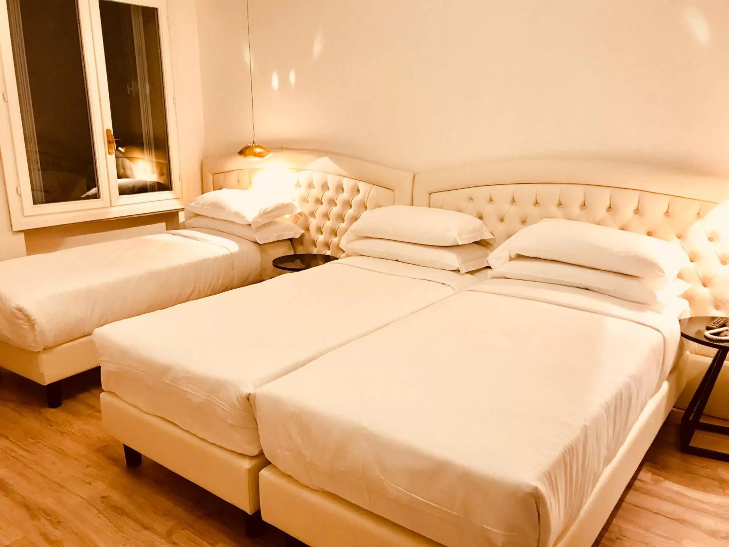 Deluxe Triple Room in Palazzo Otello 1847 Wellness & Spa Deluxe Triple Room in Palazzo Otello 1847 Wellness & Spa