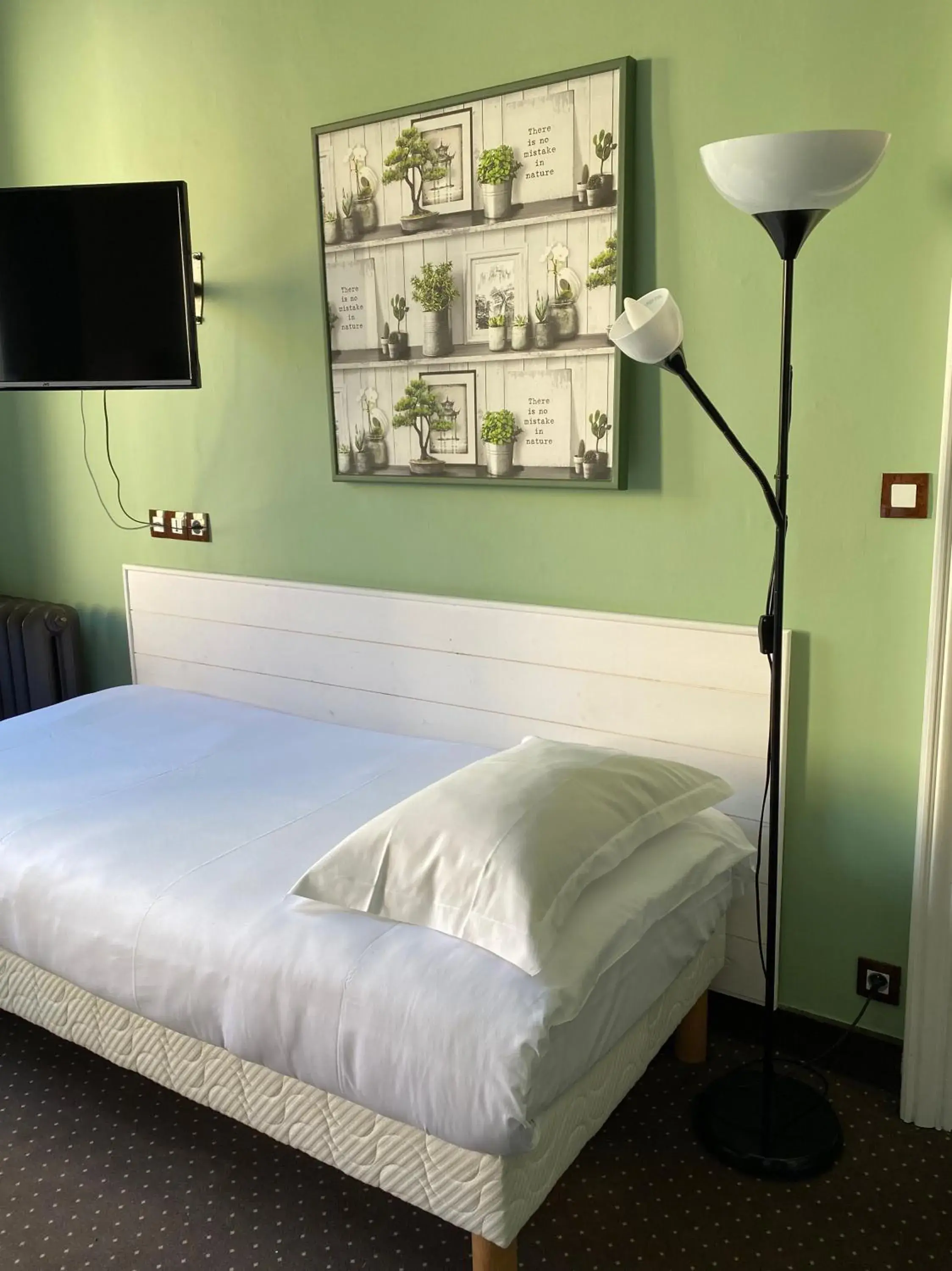 Bed in Hotel Colbert
