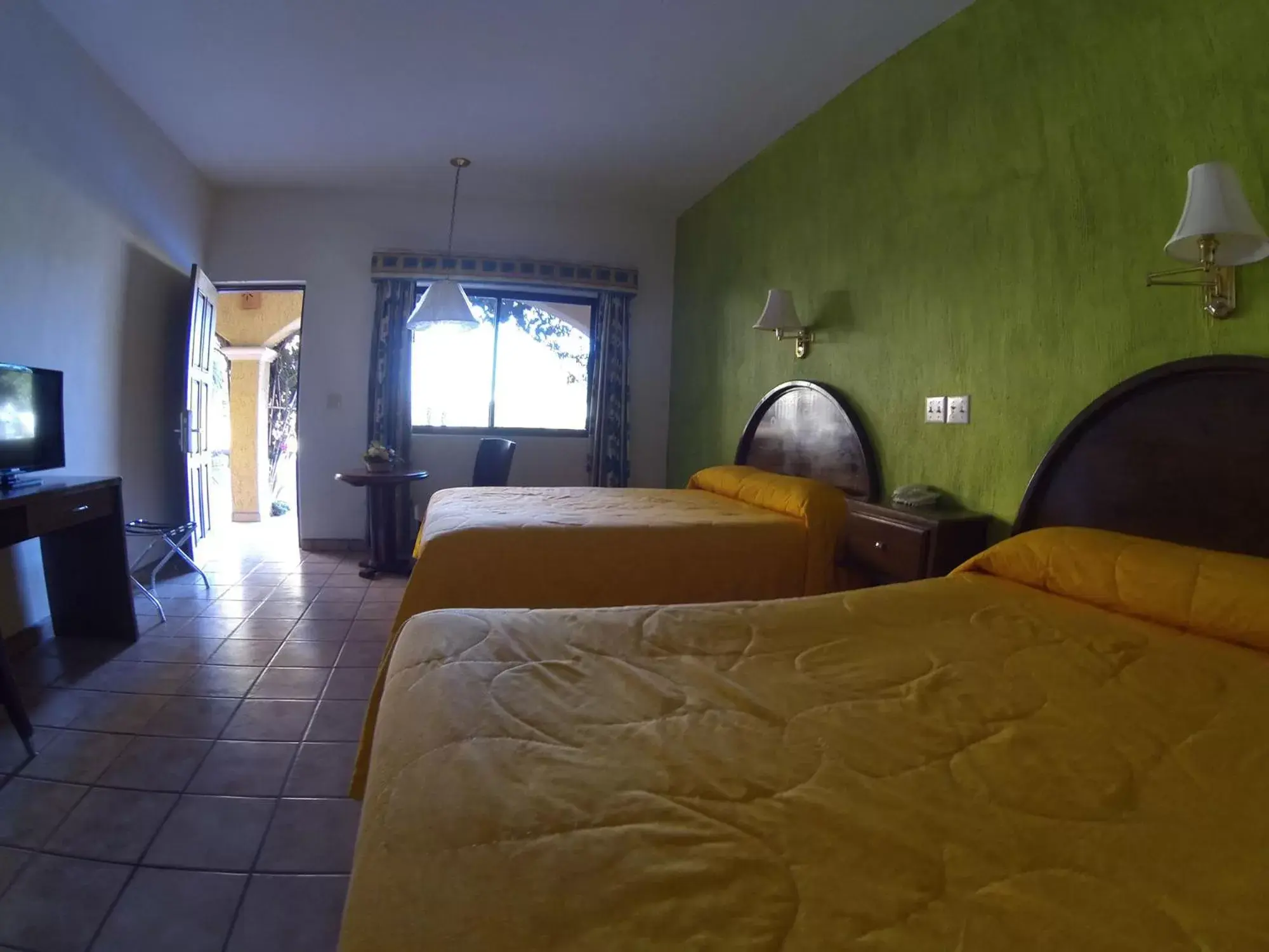 Photo of the whole room, Bed in Hacienda Suites Loreto