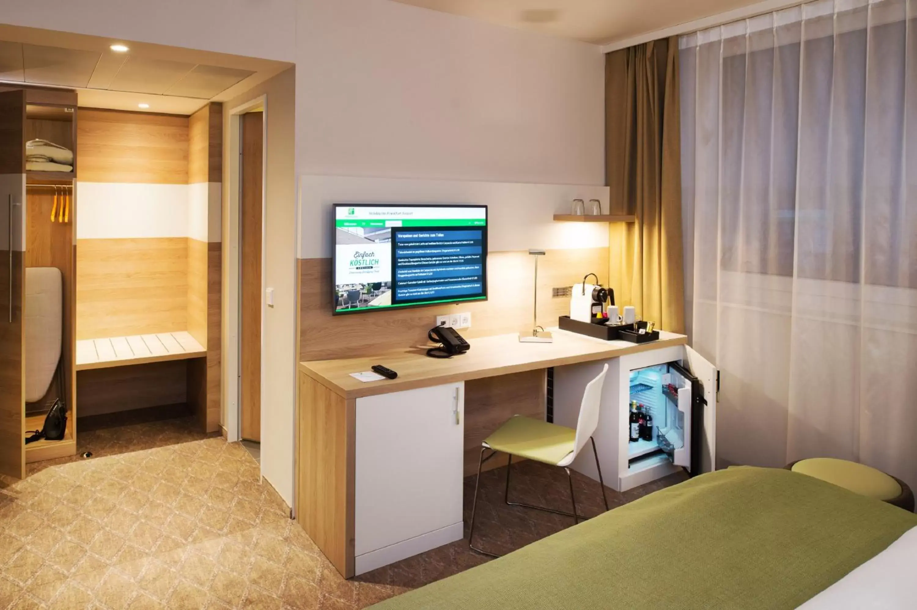 Photo of the whole room, TV/Entertainment Center in Holiday Inn Frankfurt Airport, an IHG Hotel