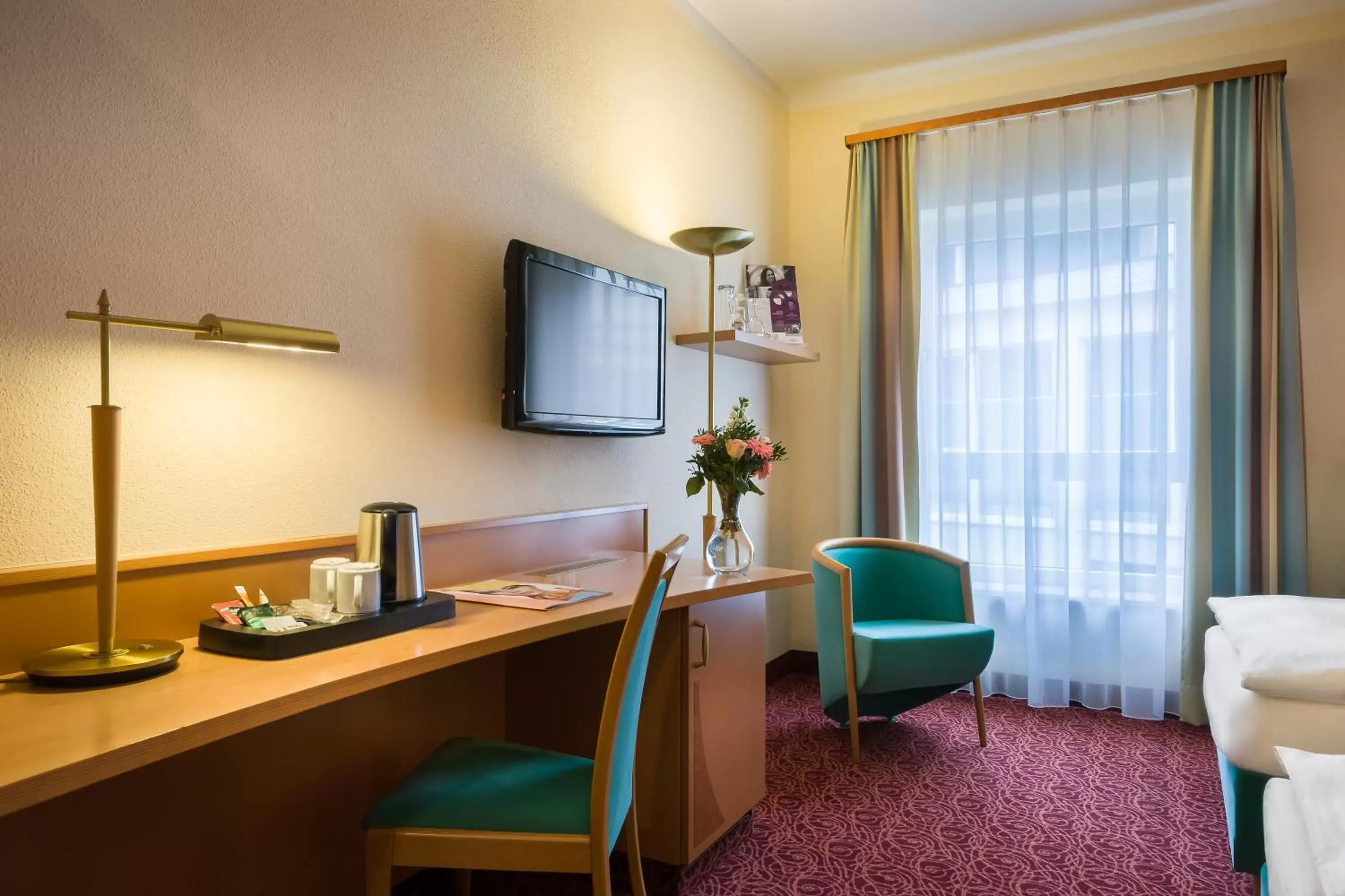 Photo of the whole room, TV/Entertainment Center in Mercure Hotel Ingolstadt