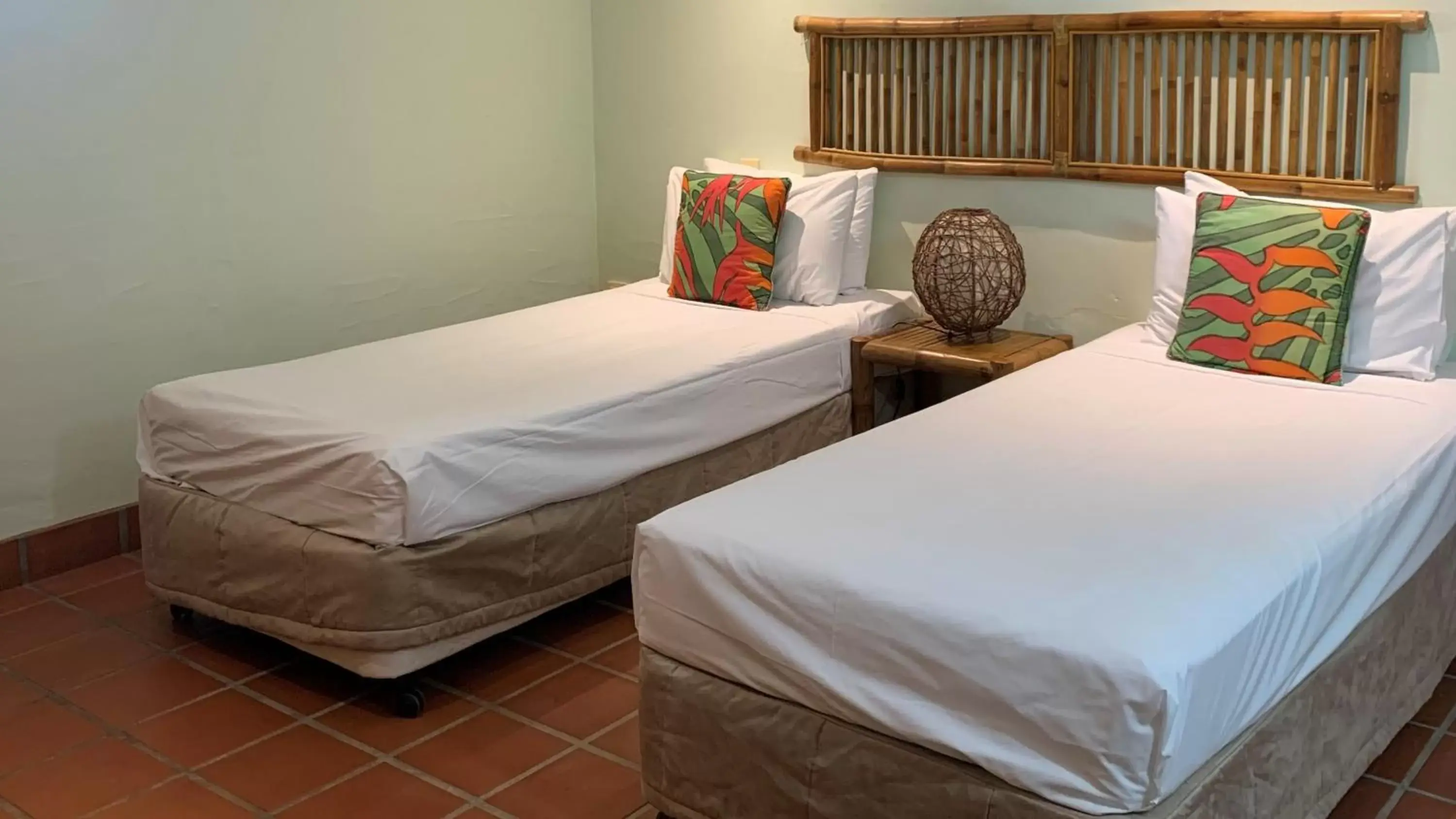 Bed in Club Tropical Resort with Onsite Reception & Check In