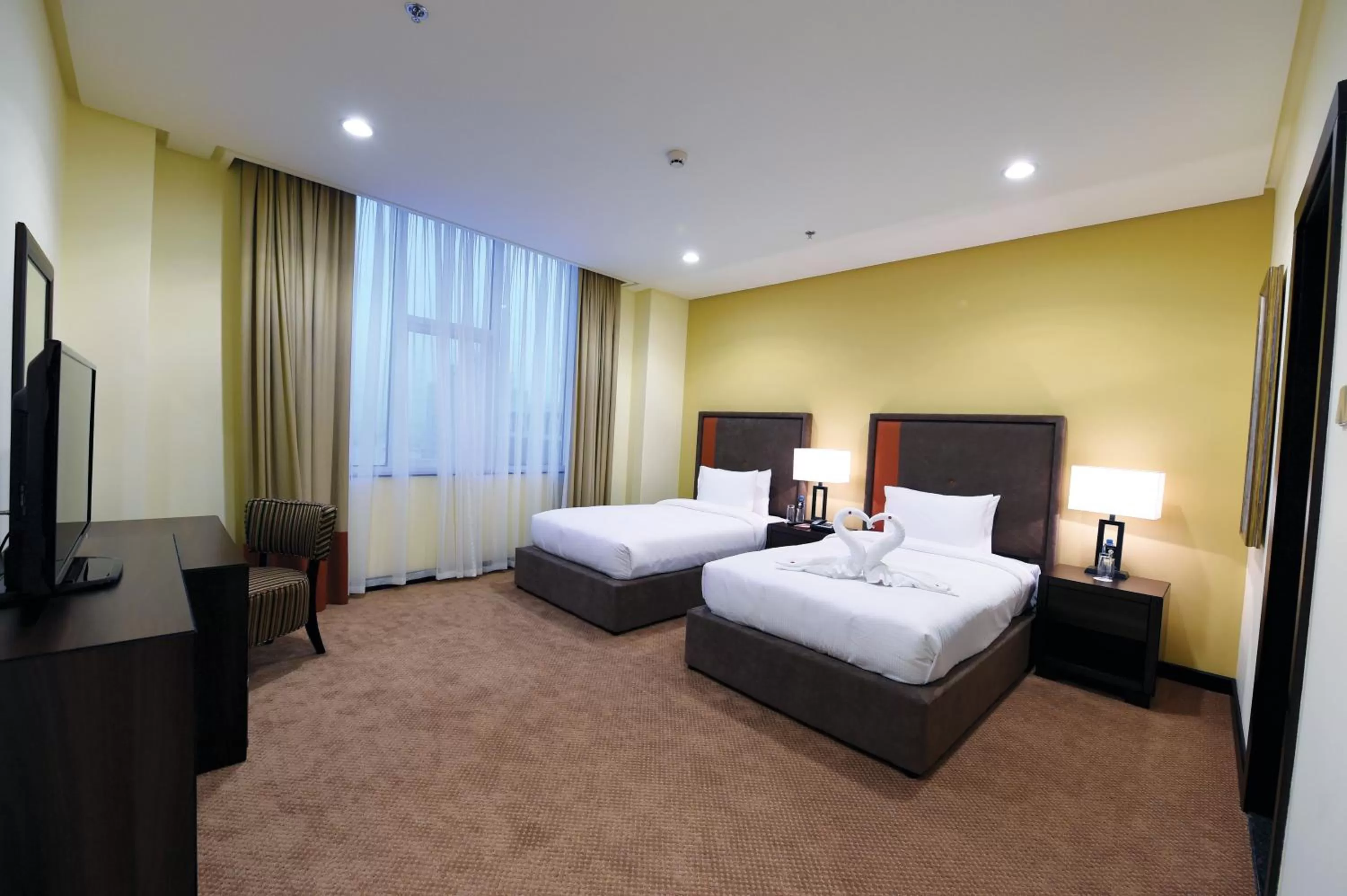Photo of the whole room, Bed in Orange Suites Hotel