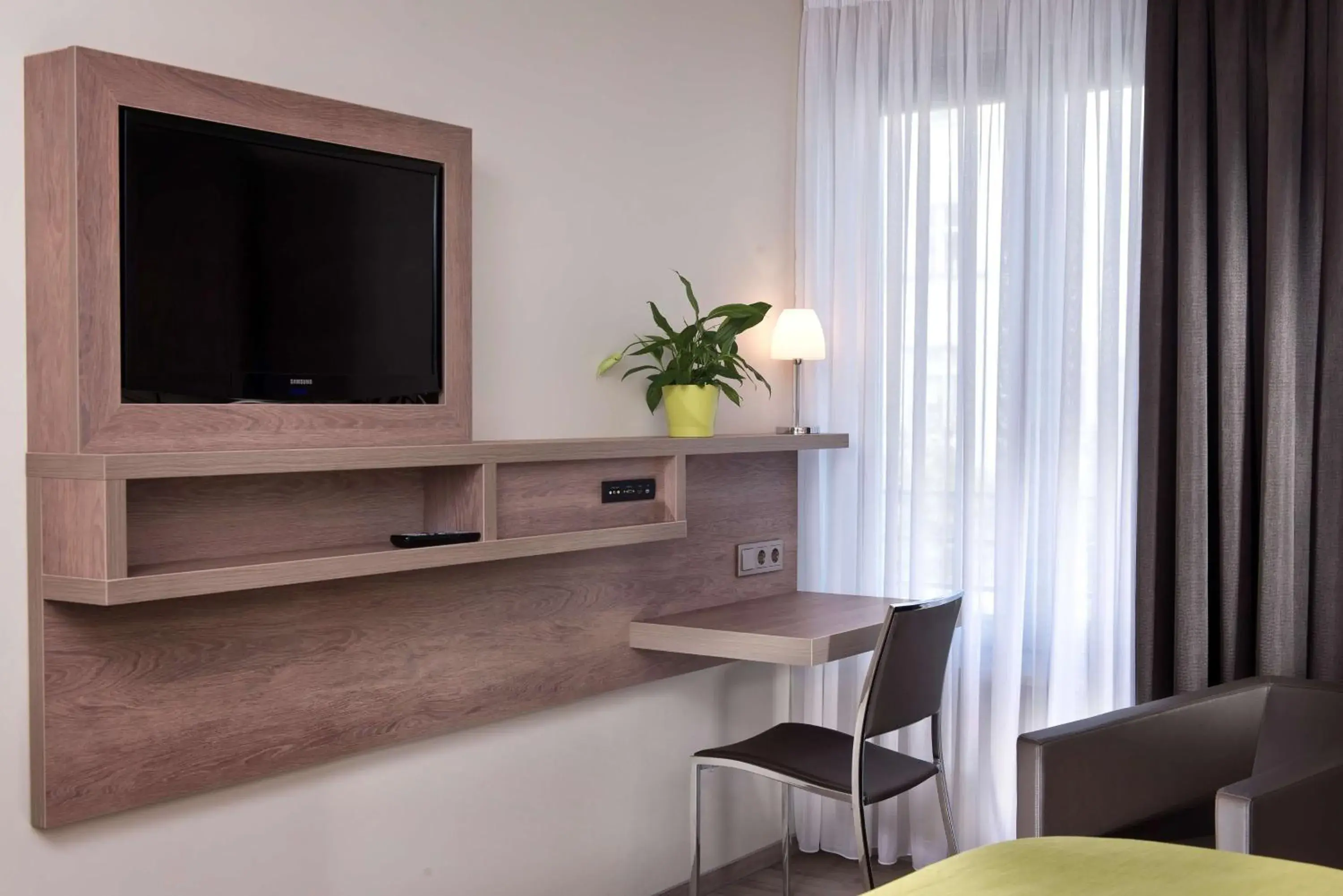 Photo of the whole room, TV/Entertainment Center in Best Western Hotel Kantstrasse Berlin
