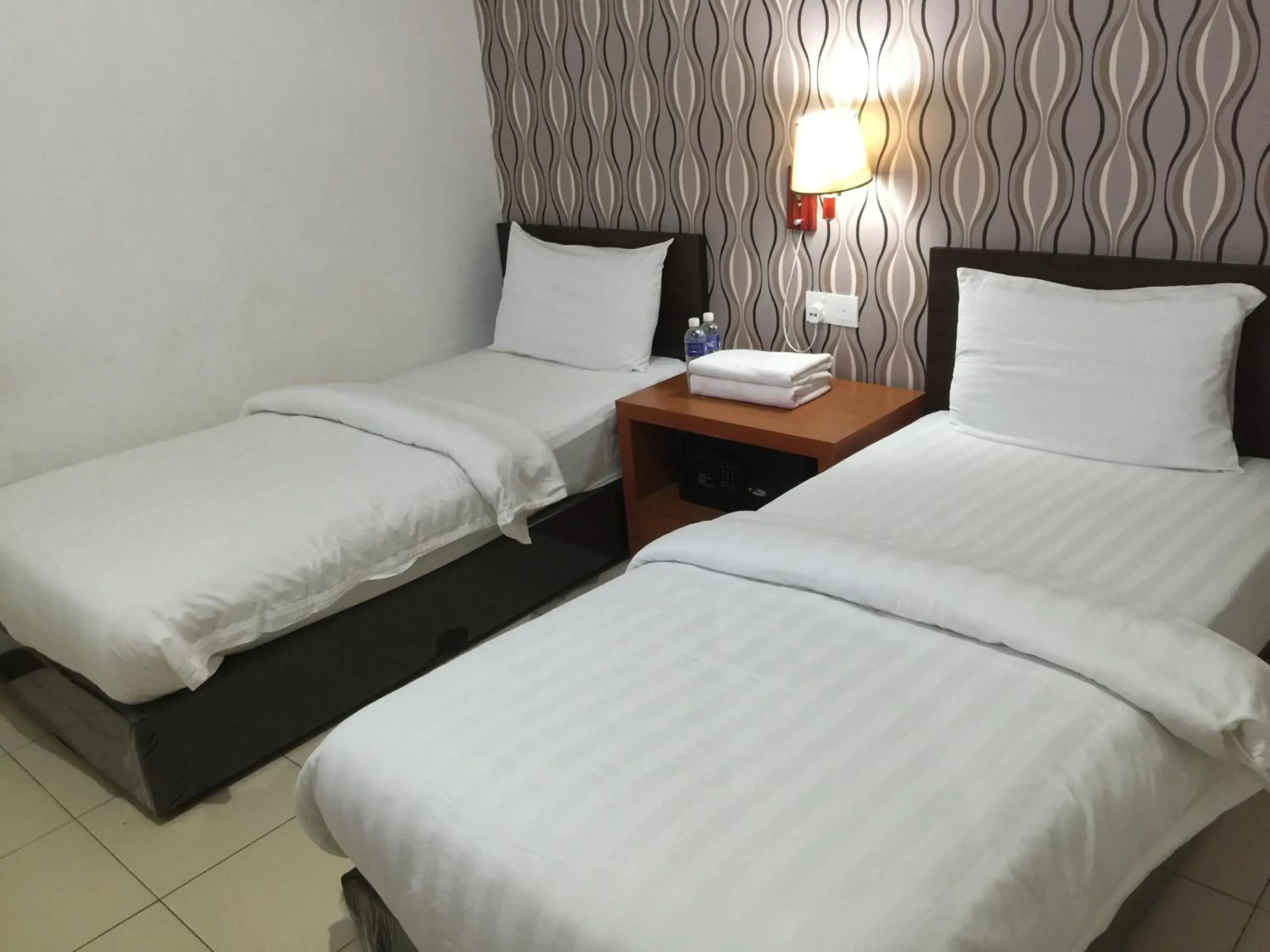 Bed in Permai Hotel