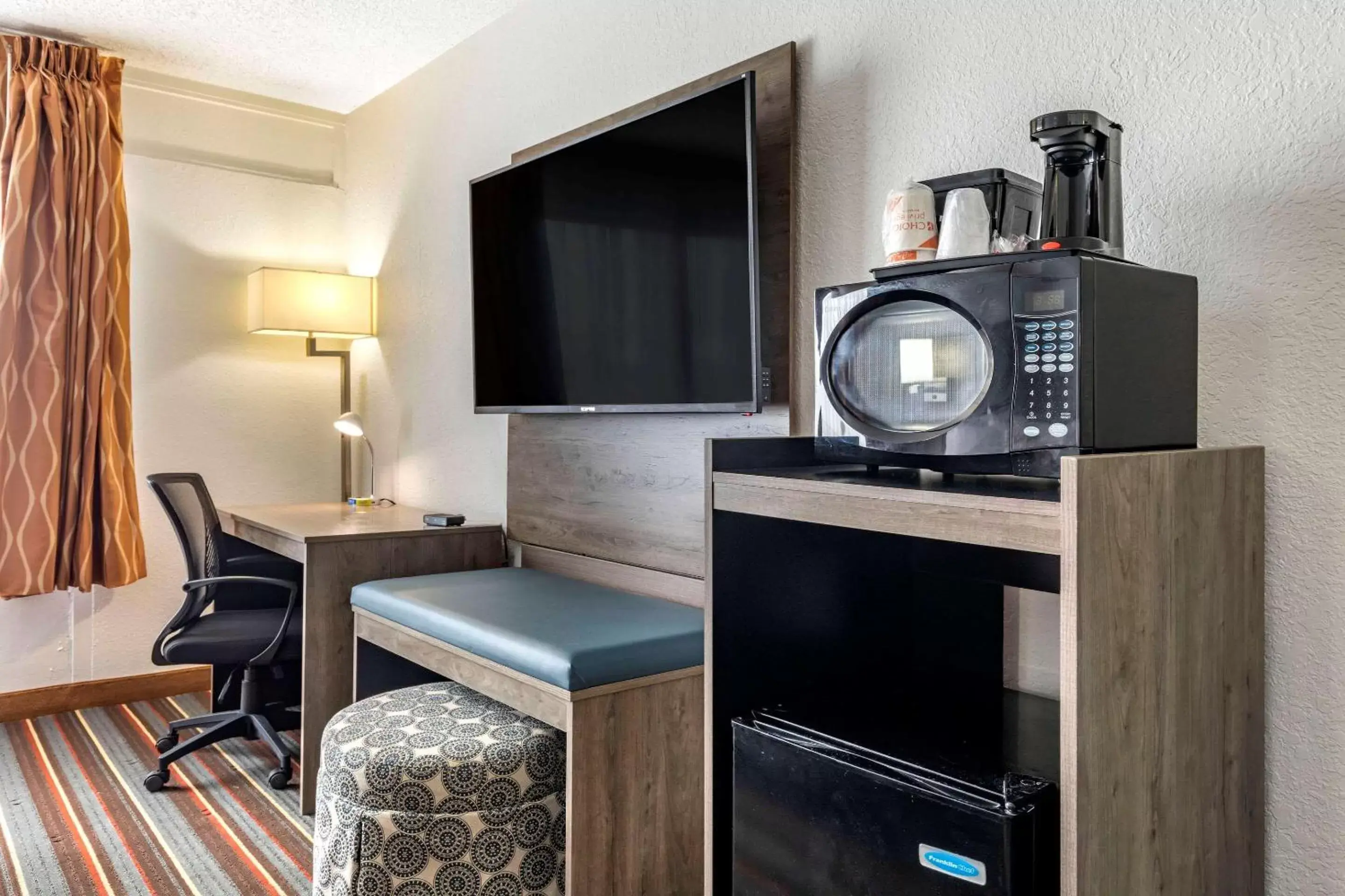 Photo of the whole room, TV/Entertainment Center in Quality Inn & Suites Sulphur Springs