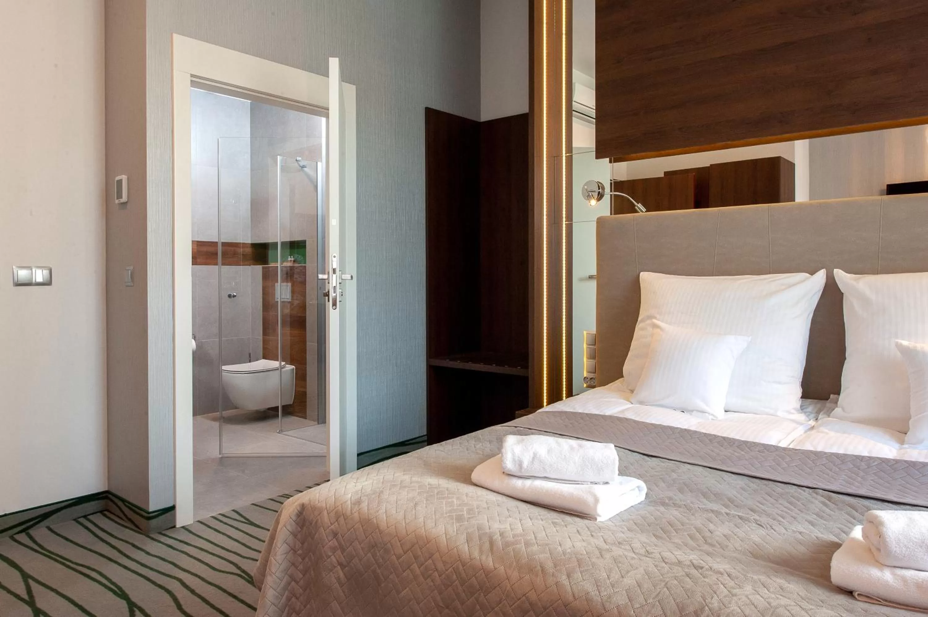 Bed in Plaza Boutique Hotel