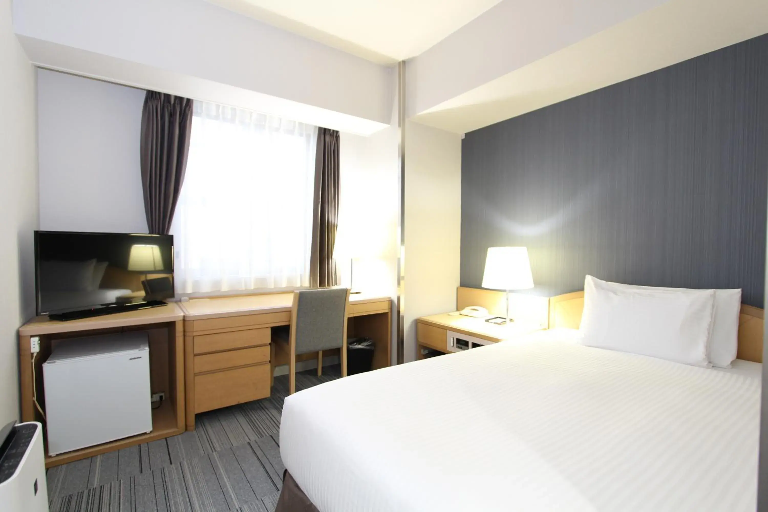 Bed in SureStay Plus Hotel by Best Western Shin-Osaka