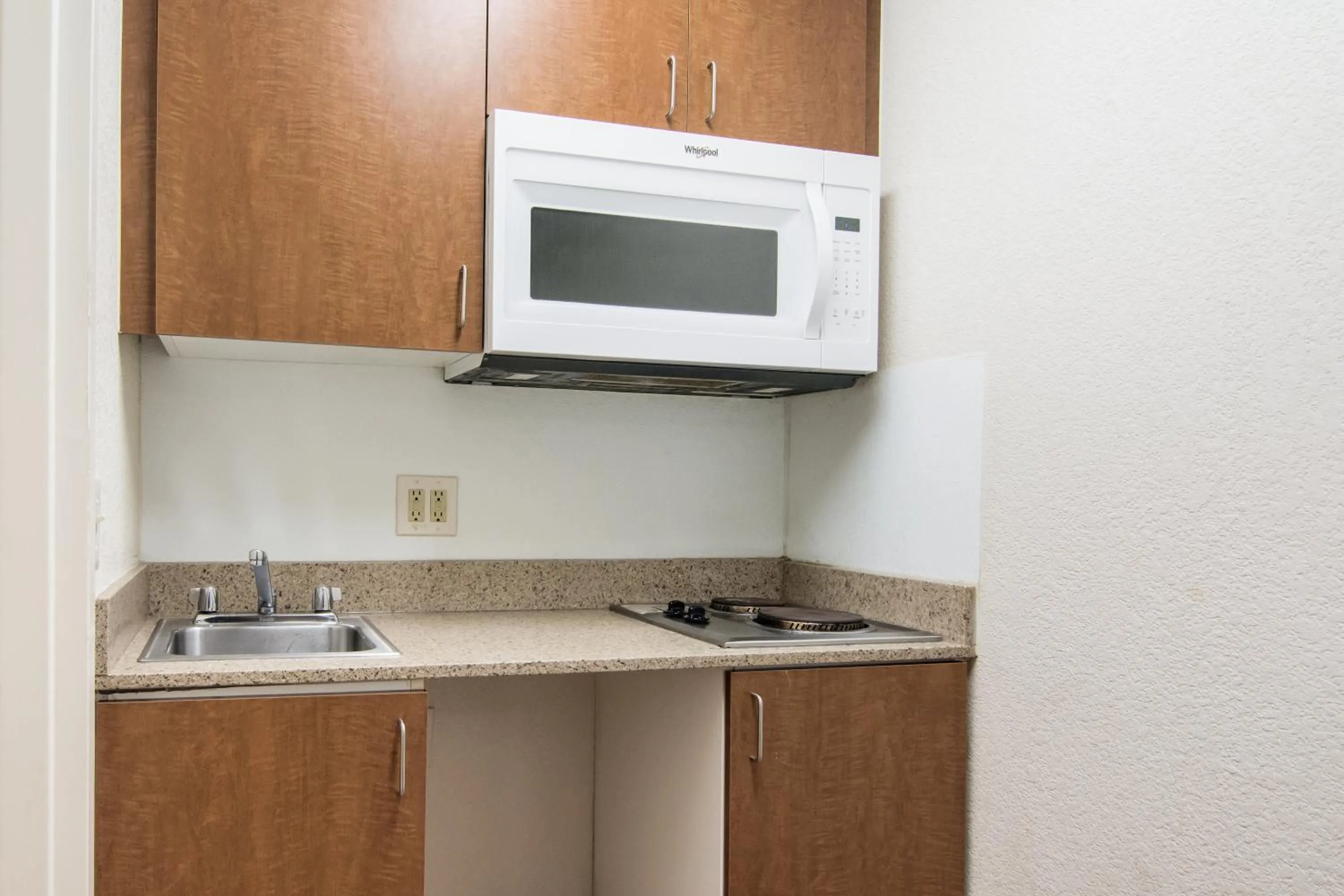 Photo of the whole room in HomeTowne Studios by Red Roof Raleigh – Durham