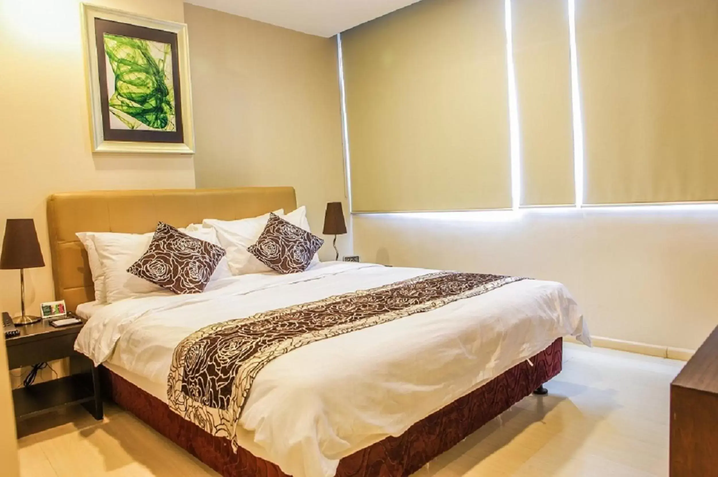 Bed in The Exchange Regency Residence Hotel Managed by HII
