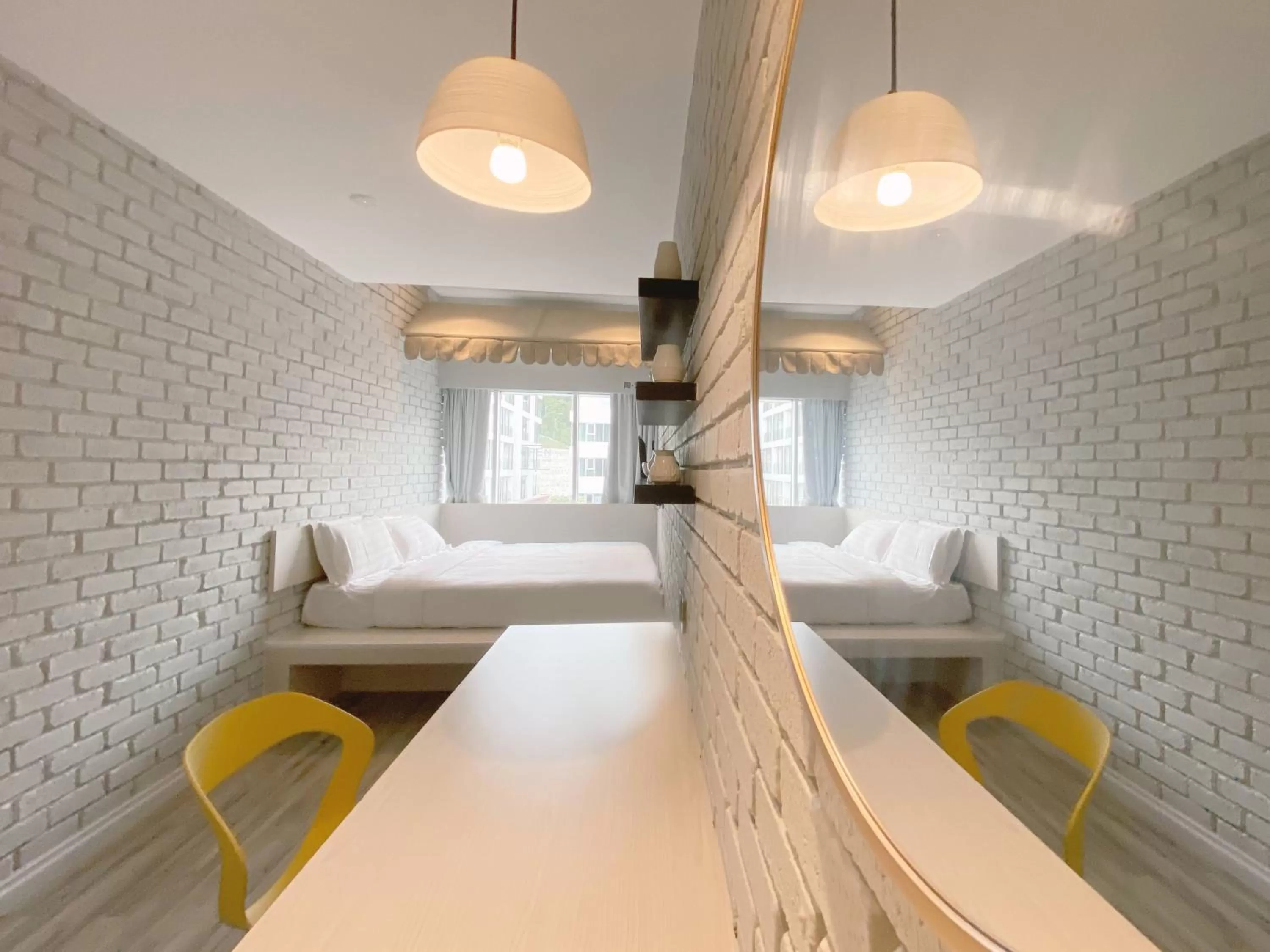 Bed in The Atelier Boutique Hotel