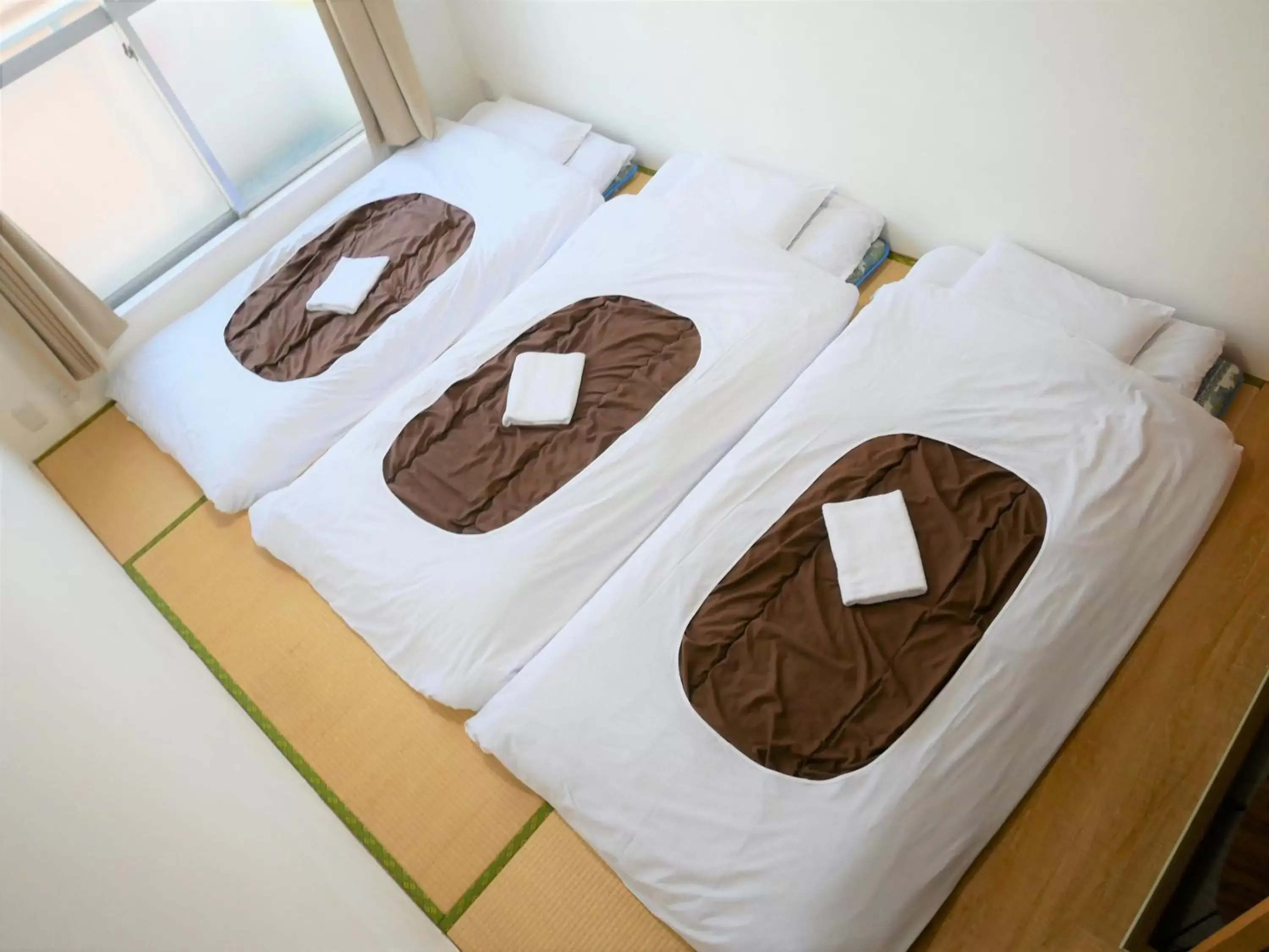 Bed in Sakura Hotel Nippori
