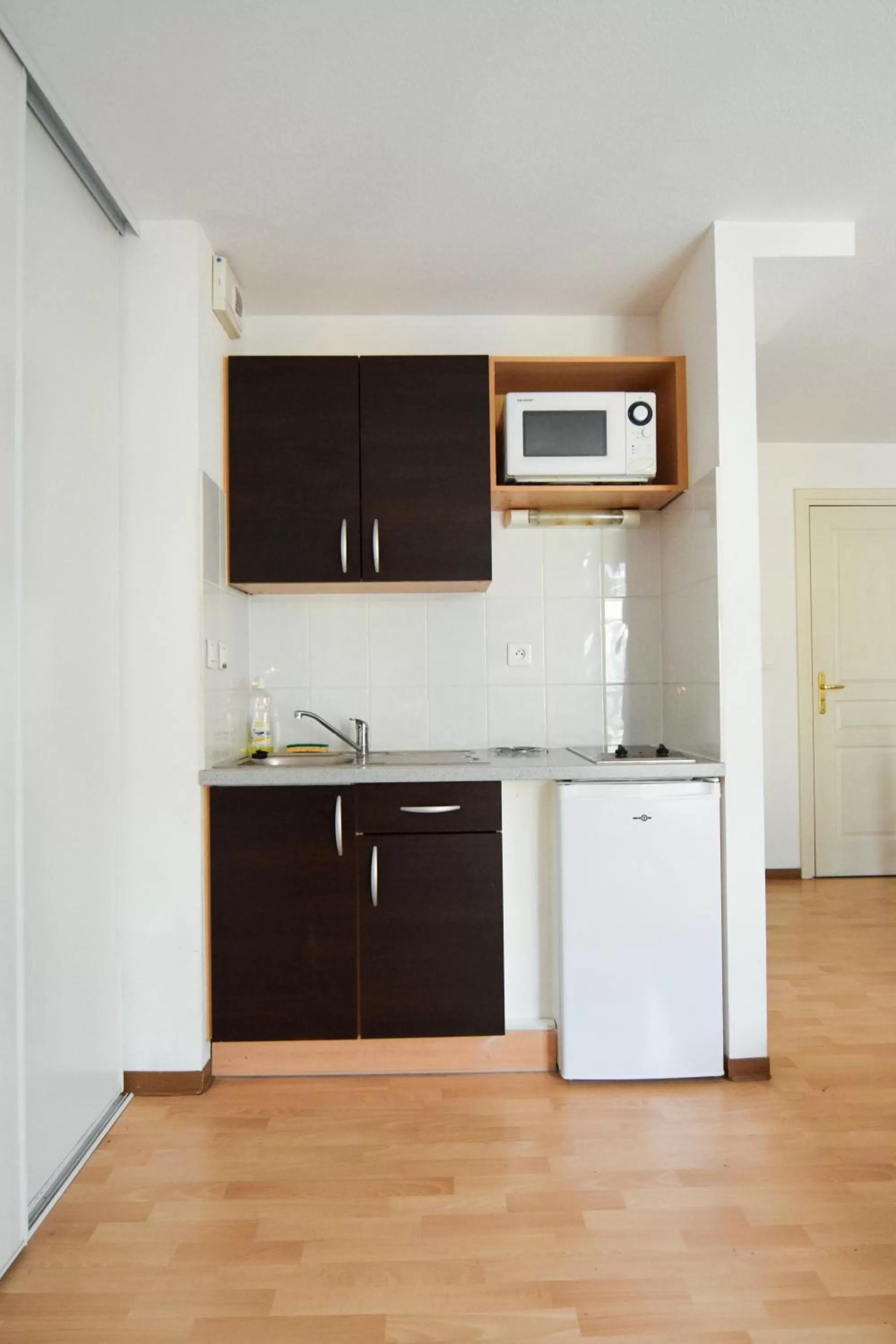 Kitchen or kitchenette in Residhotel Mulhouse Centre
