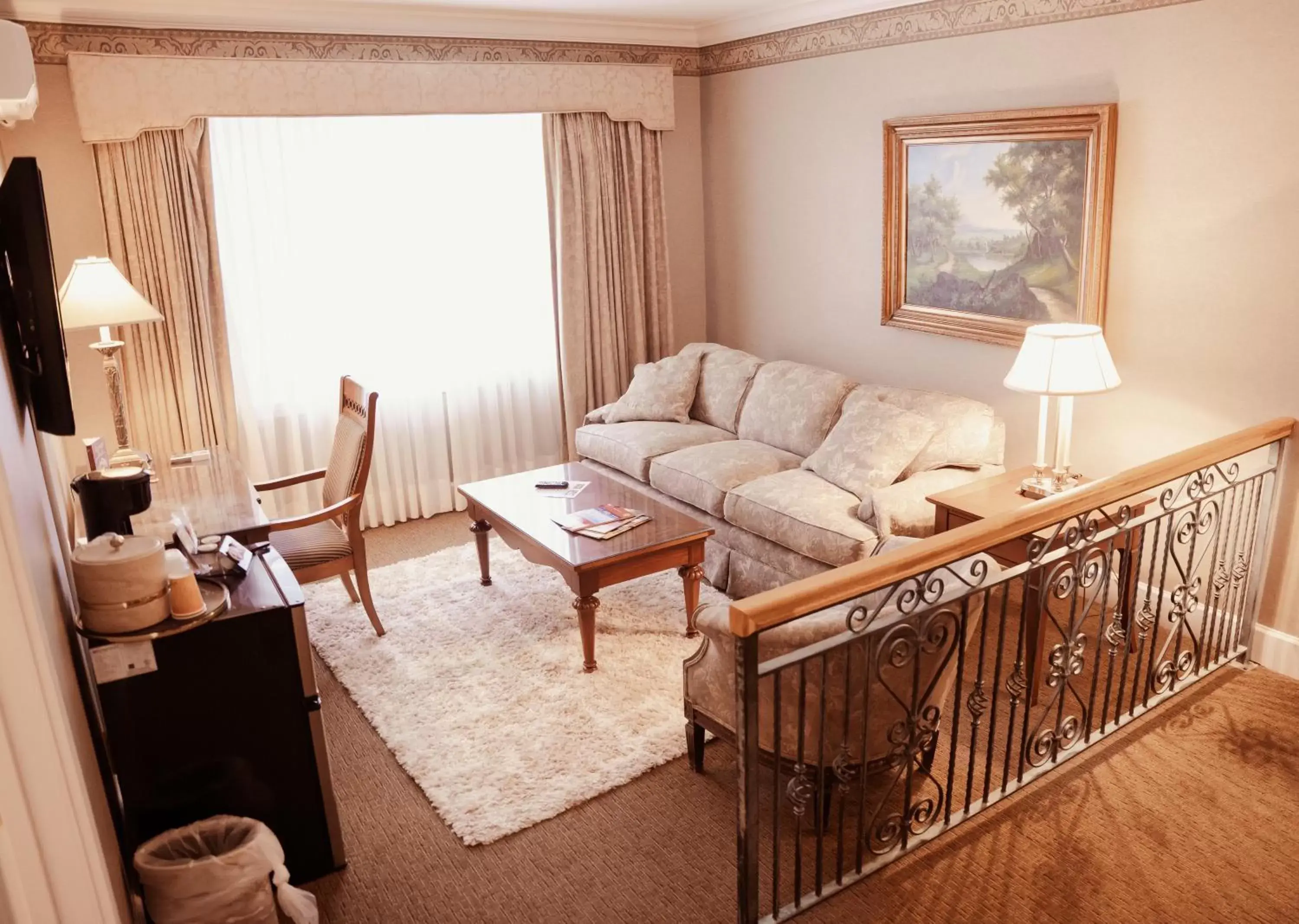 Bed, Seating Area in Phoenix Inn Resort