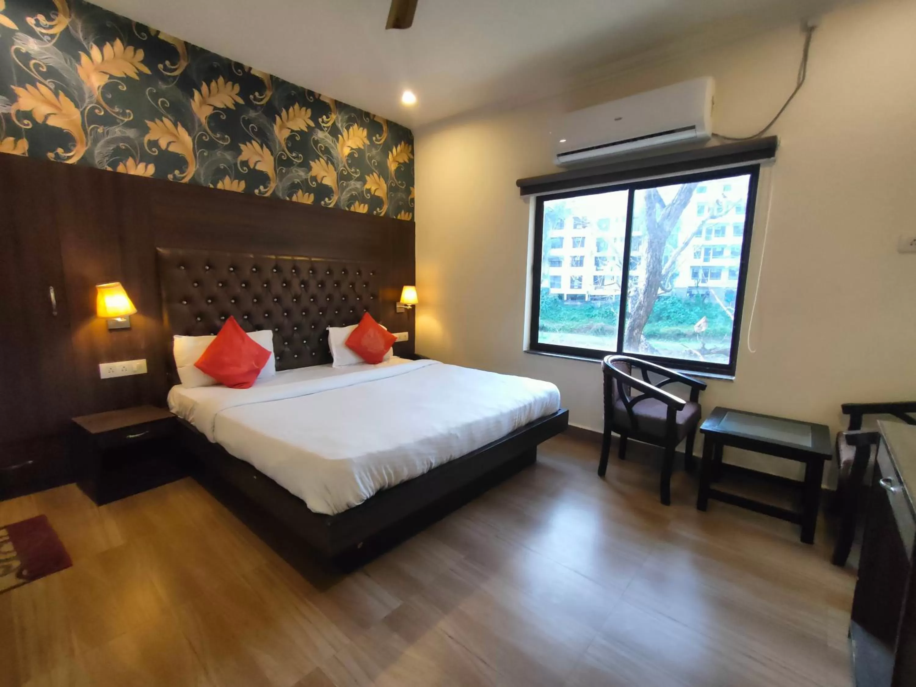 Photo of the whole room, Bed in Tapasthali by Meera Hotels