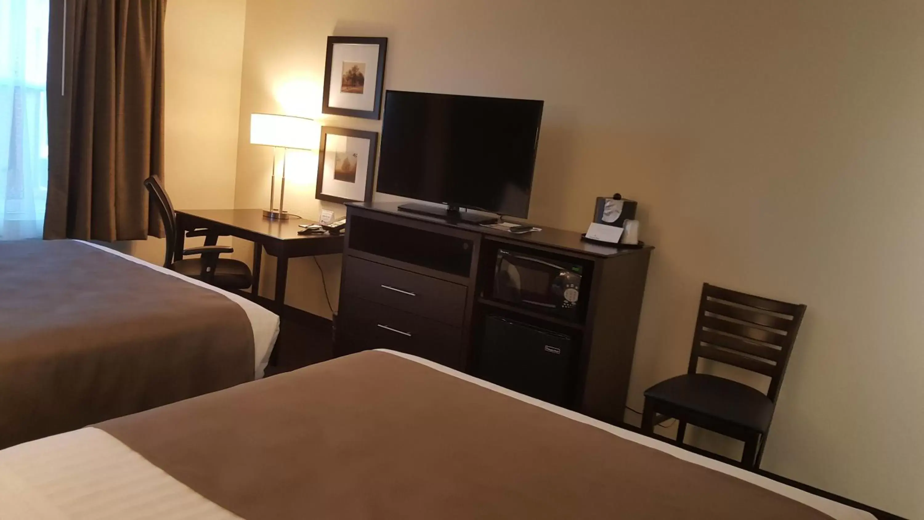 Photo of the whole room, TV/Entertainment Center in AmericInn by Wyndham Burnsville
