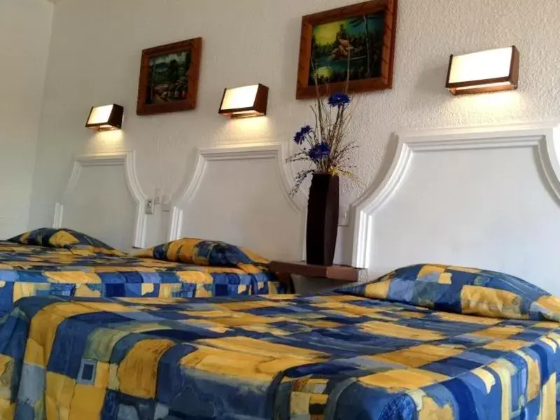 Bed in Hotel Paraiso