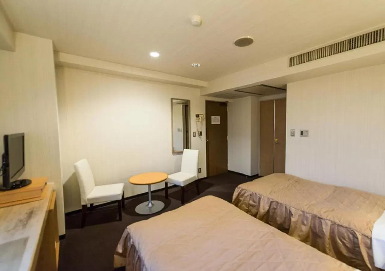 Bed in HOTEL LiVEMAX Kofu