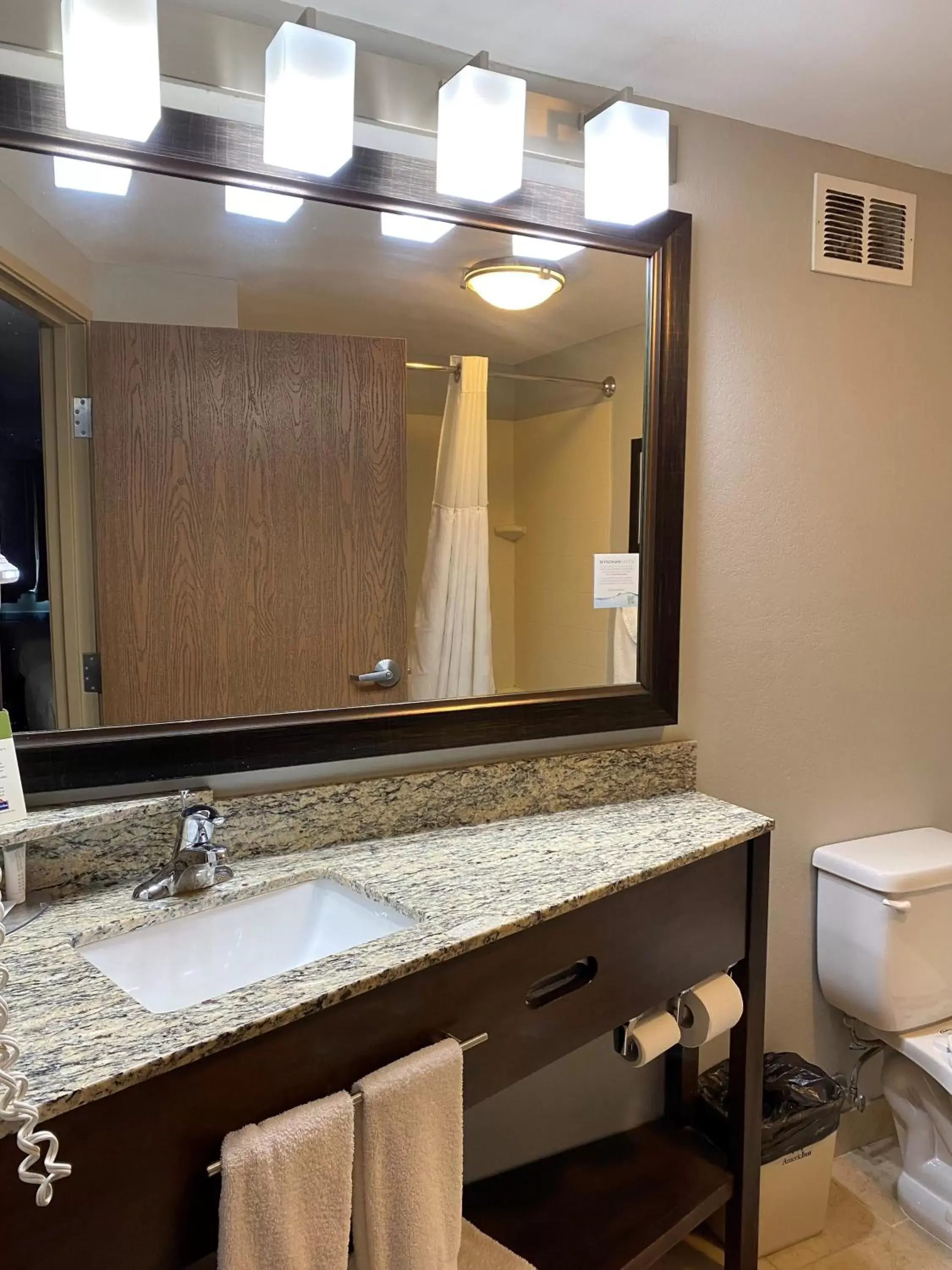 Bathroom in AmericInn by Wyndham Algona