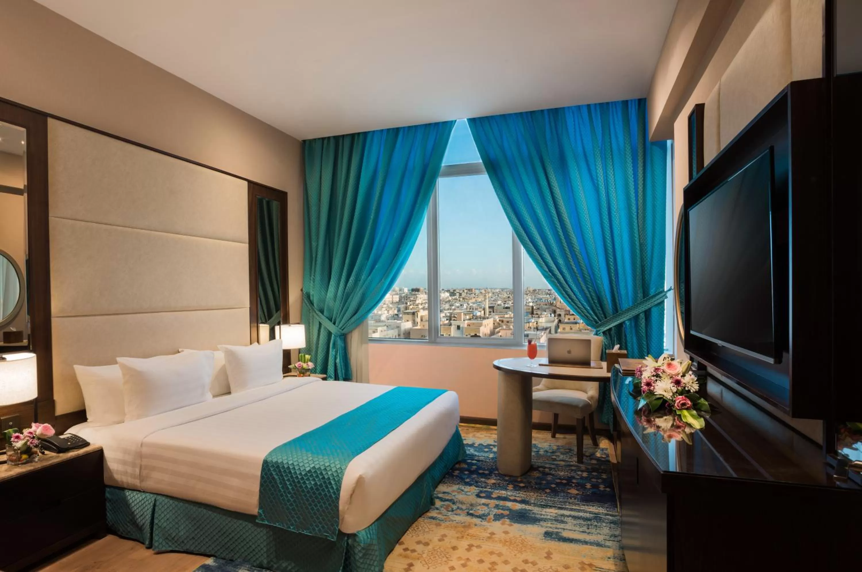 Communal lounge/ TV room, Bed in Naviti Warwick Dammam