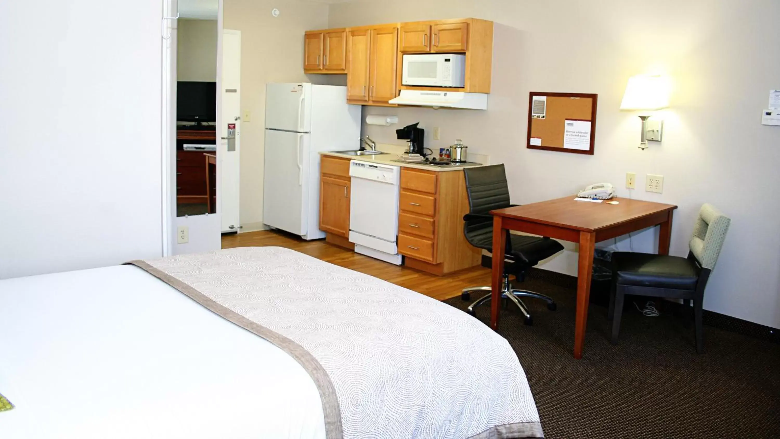 Bedroom, Kitchen/Kitchenette in Candlewood Suites Harrisonburg, an IHG Hotel
