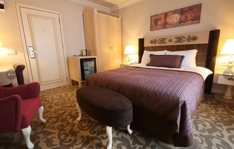 Bed in Sonno Boutique Rooms & Suites