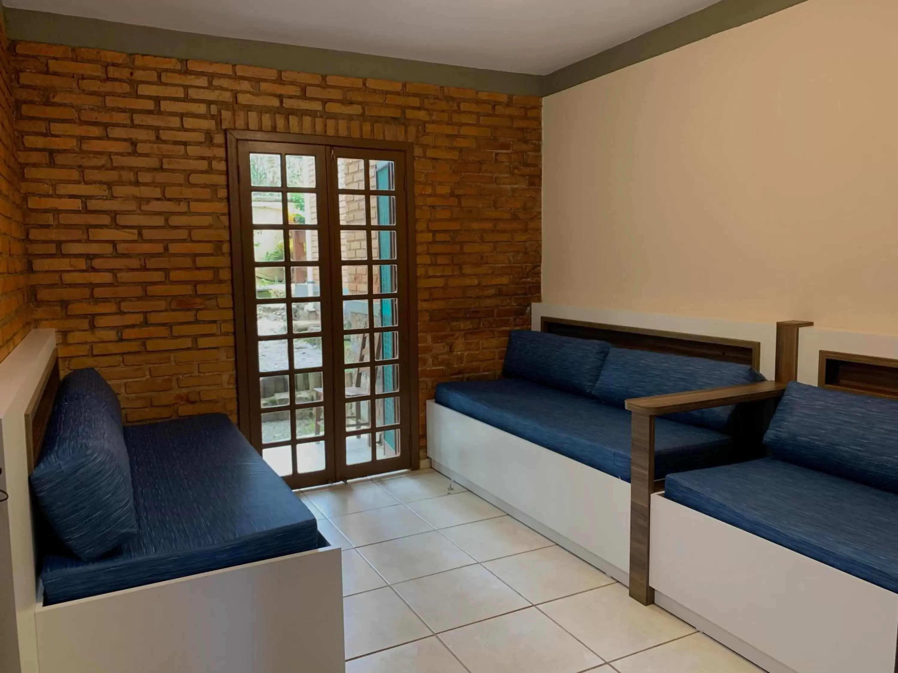 Bed, Seating Area in Hotel São Sebastião da Praia