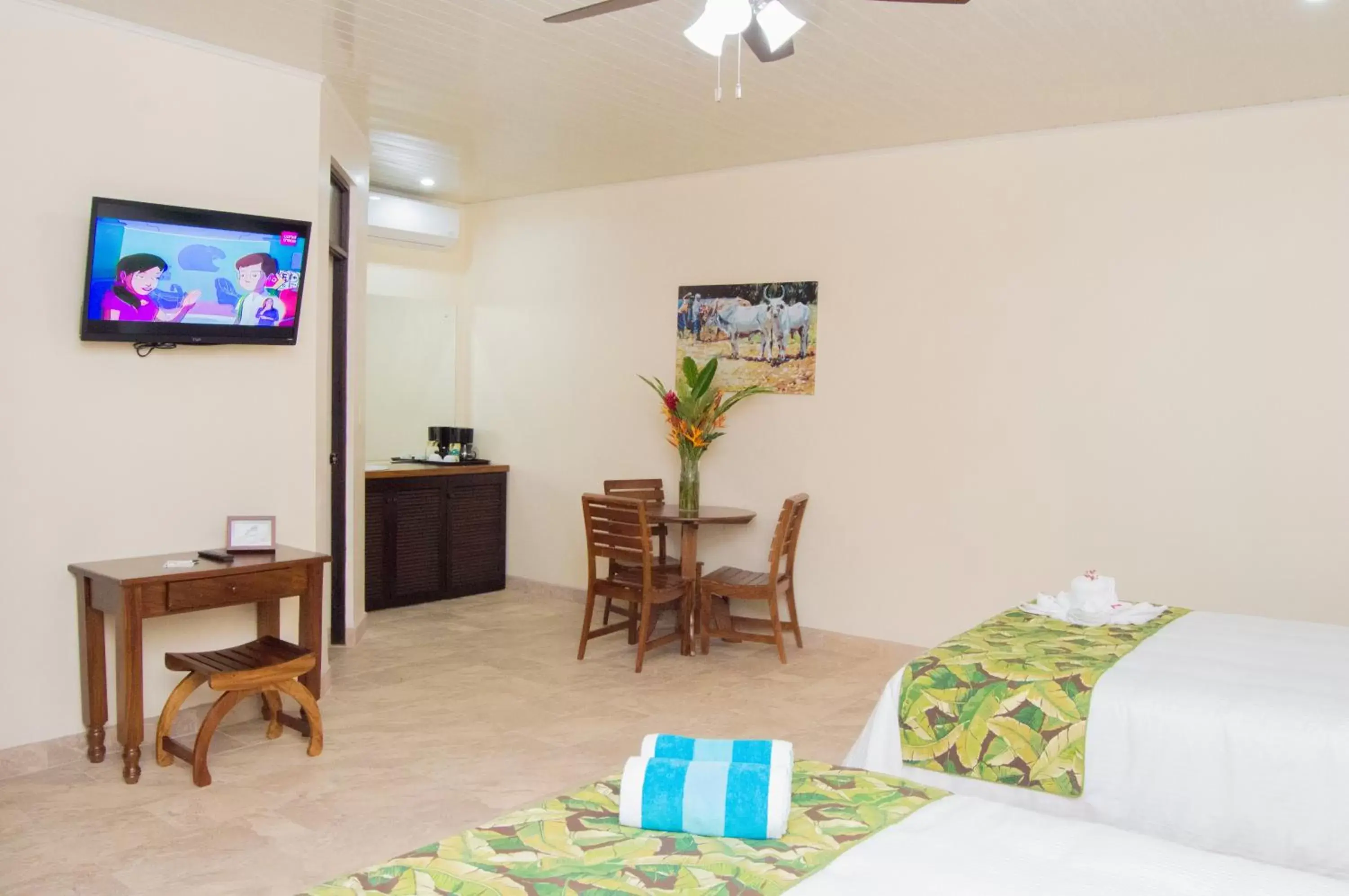 Bed, TV/Entertainment Center in La Foresta Nature Resort