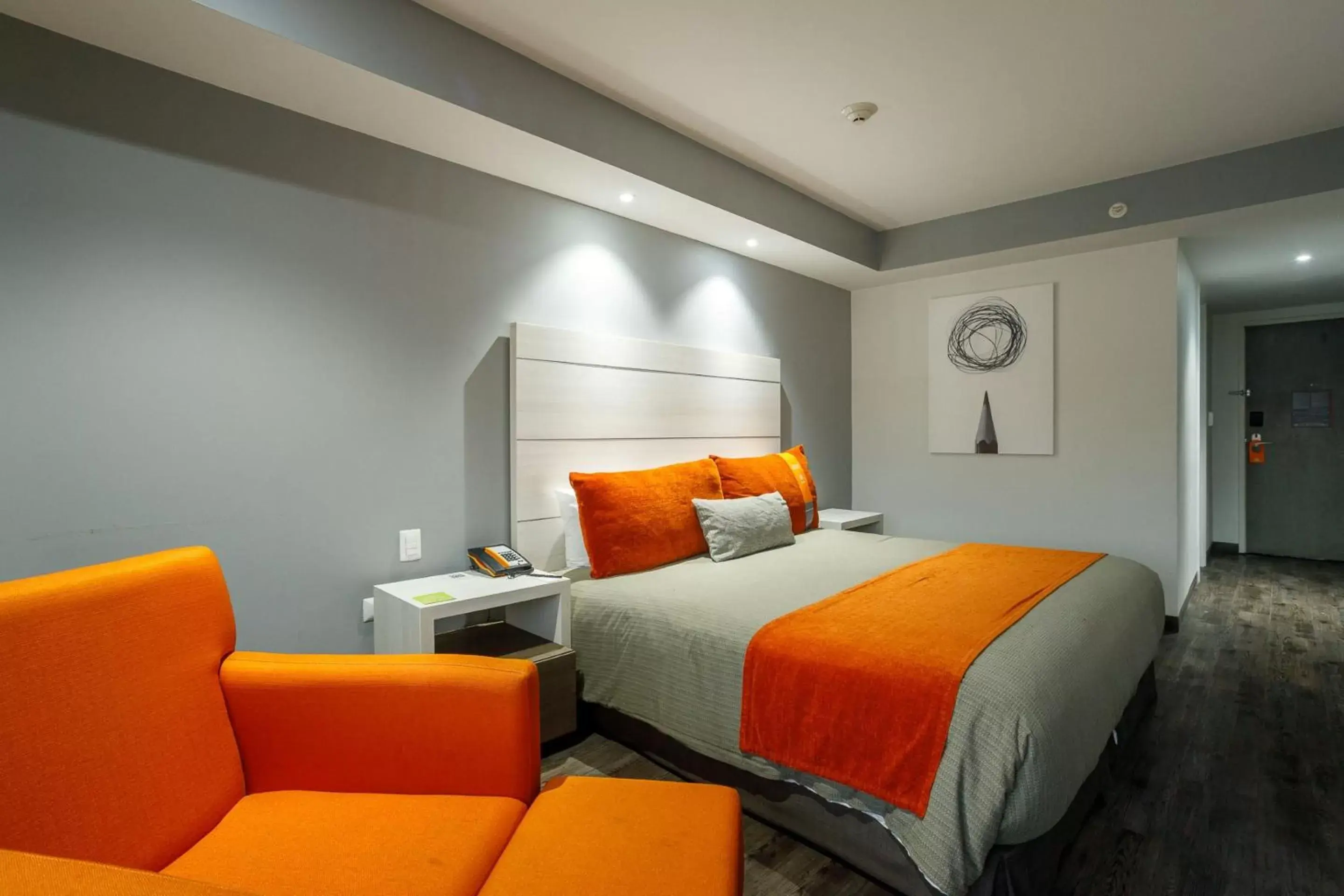 Photo of the whole room, Bed in Real Inn Tijuana by Camino Real Hotels