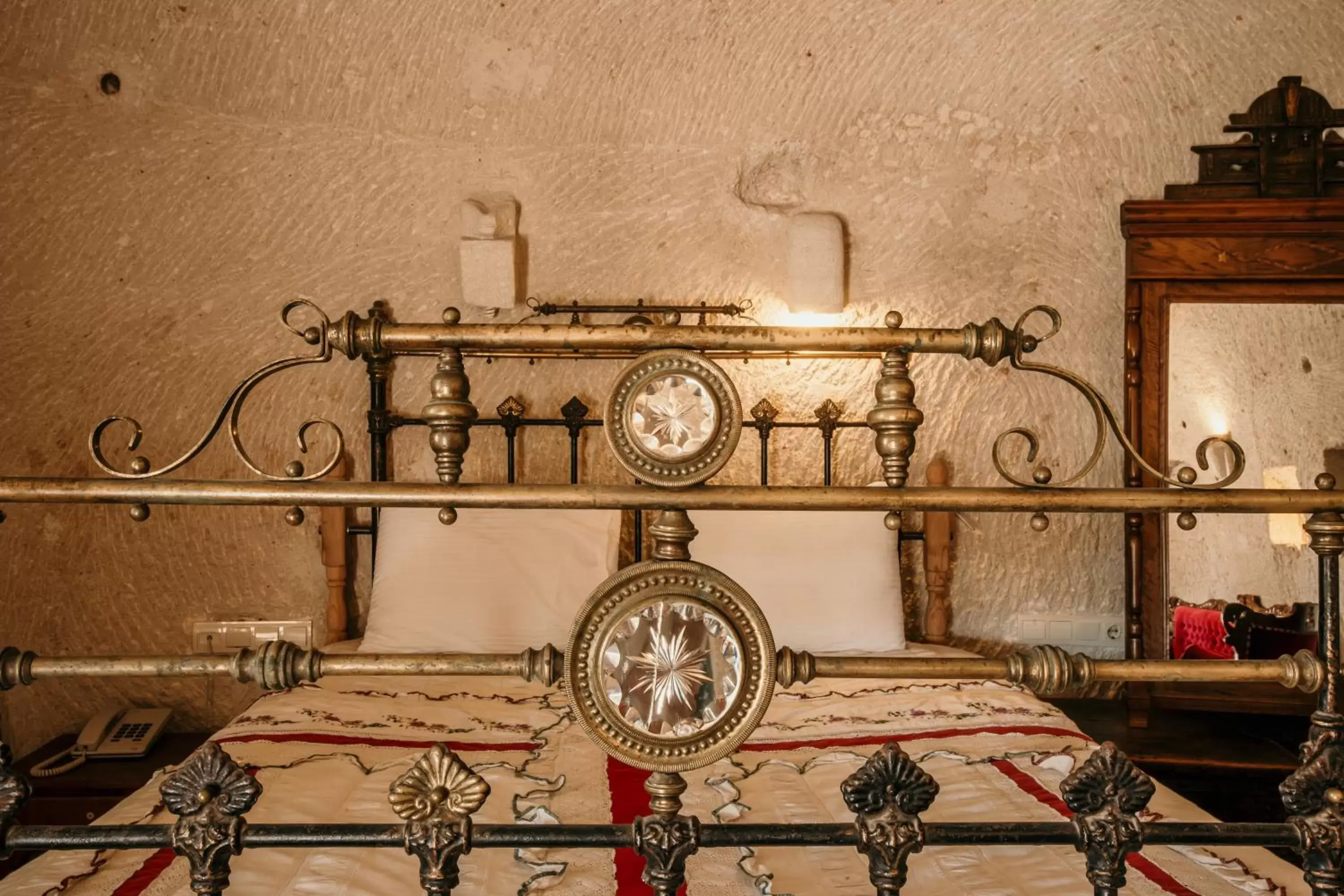 Bed in Village Cave House Hotel