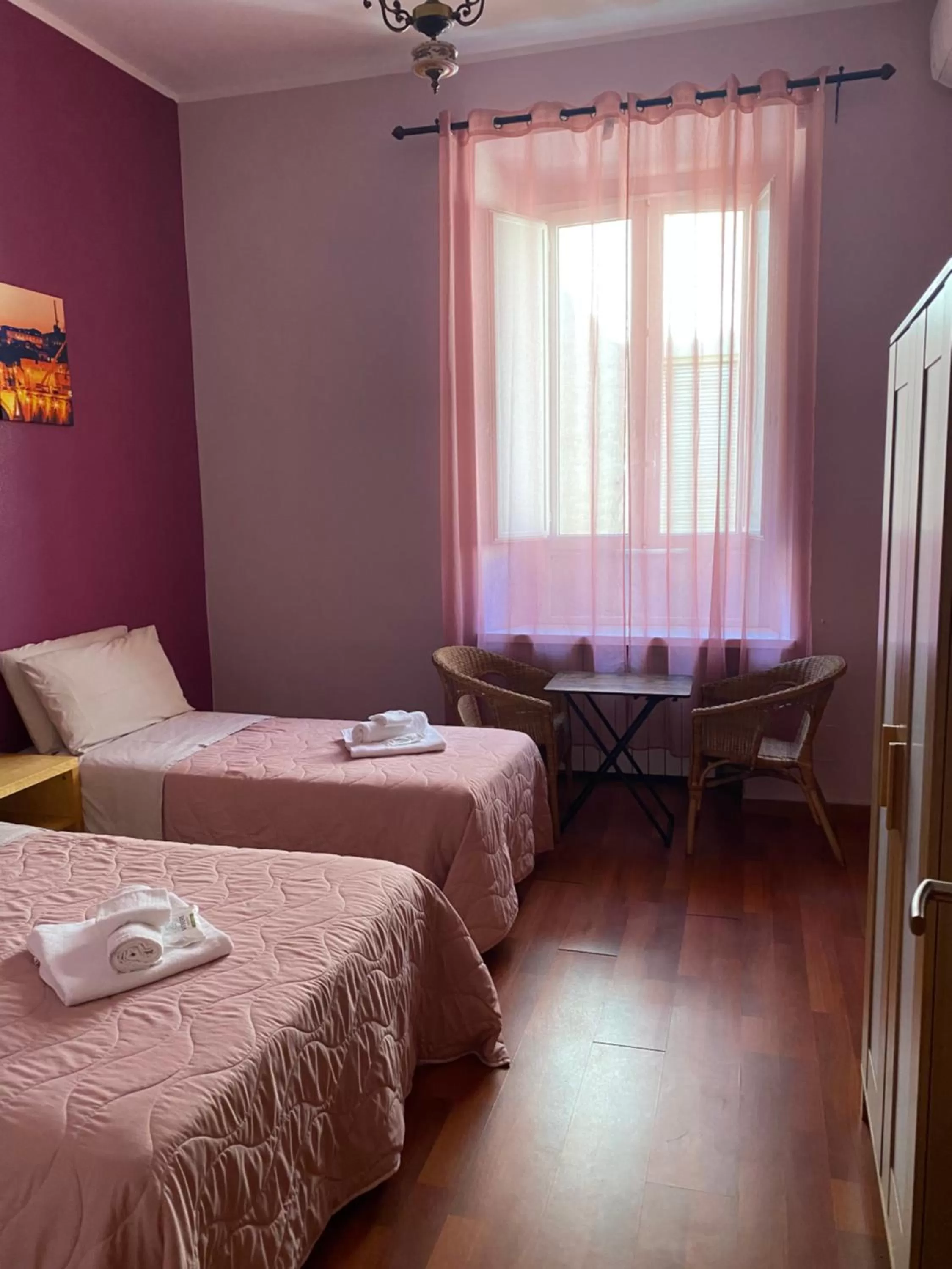 Bed in AmareRomaRooms