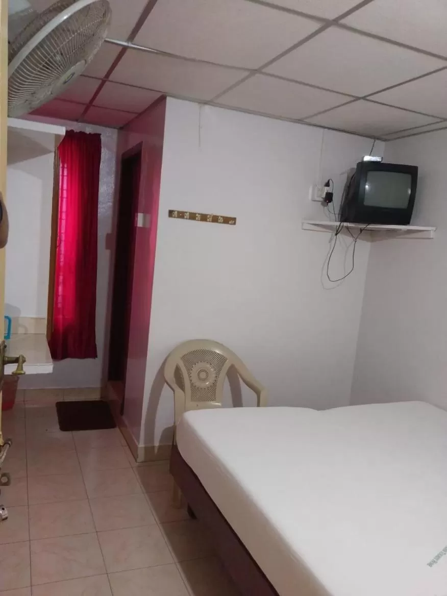 Bed in Anandan Tourist Home