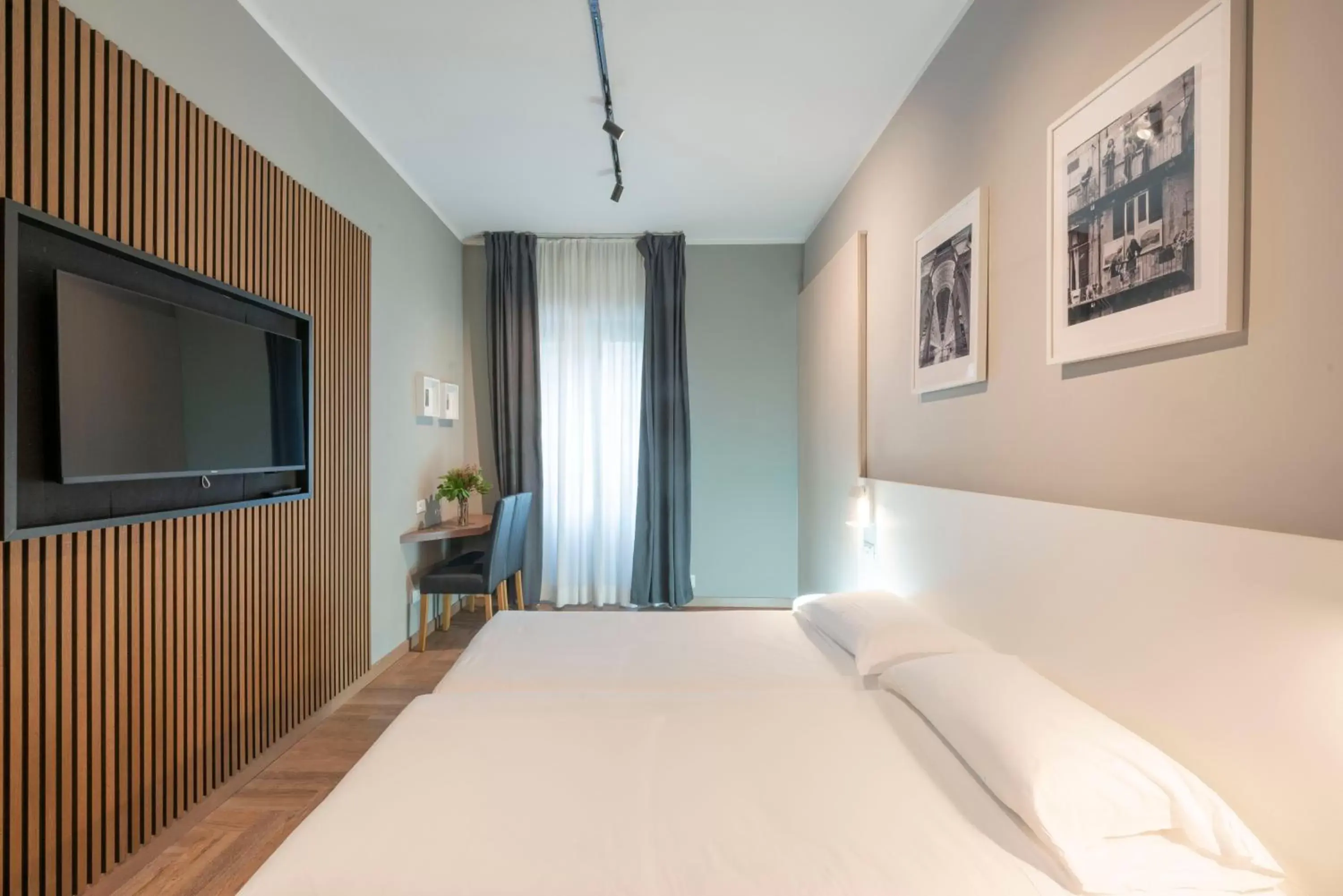 Bed in Kleos Hotel Milano