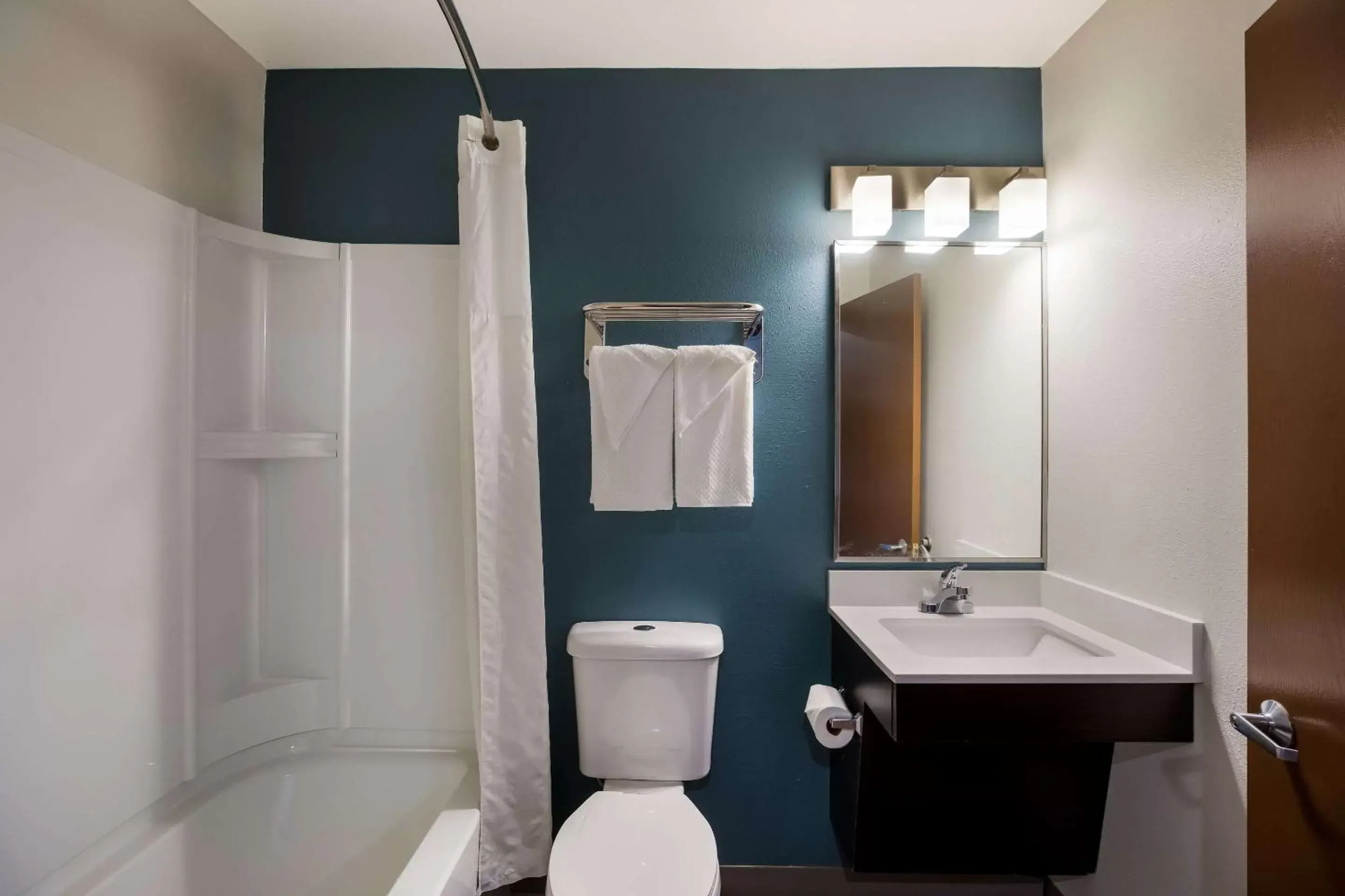Bedroom, Bathroom in WoodSpring Suites Orlando West - Clermont
