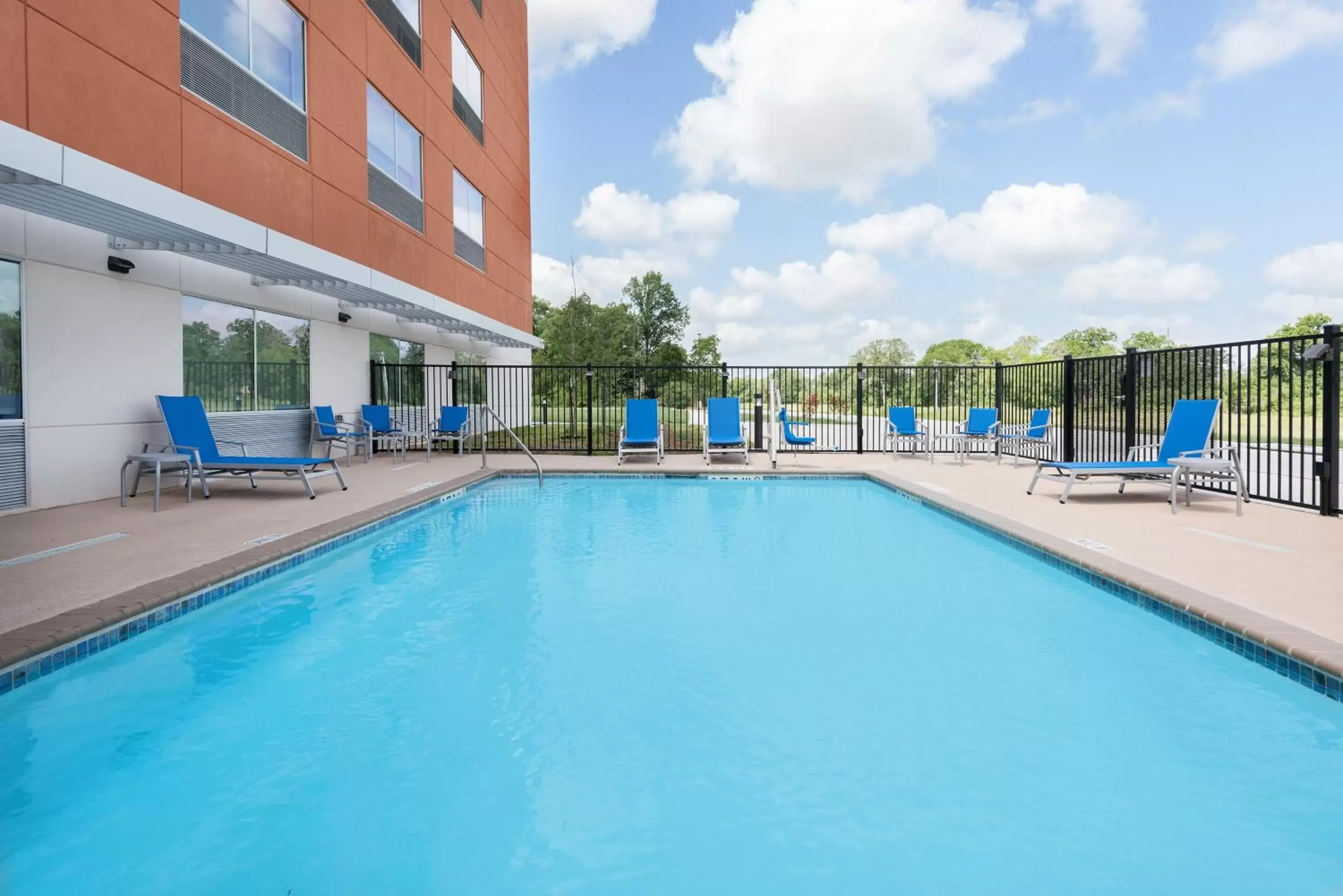Swimming Pool in Holiday Inn Express & Suites Bryan - College Station, an IHG Hotel