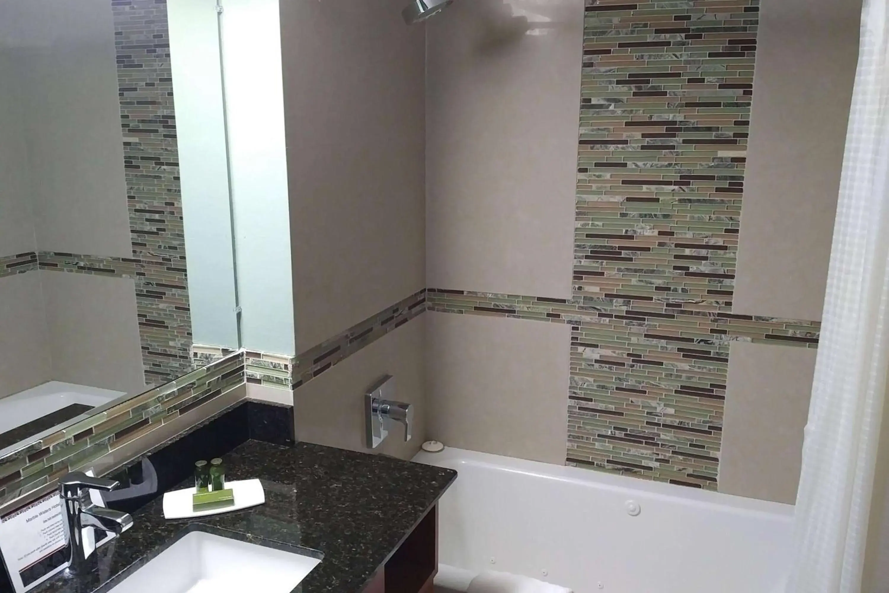 TV and multimedia, Bathroom in Marble Waters Hotel & Suites, Trademark by Wyndham