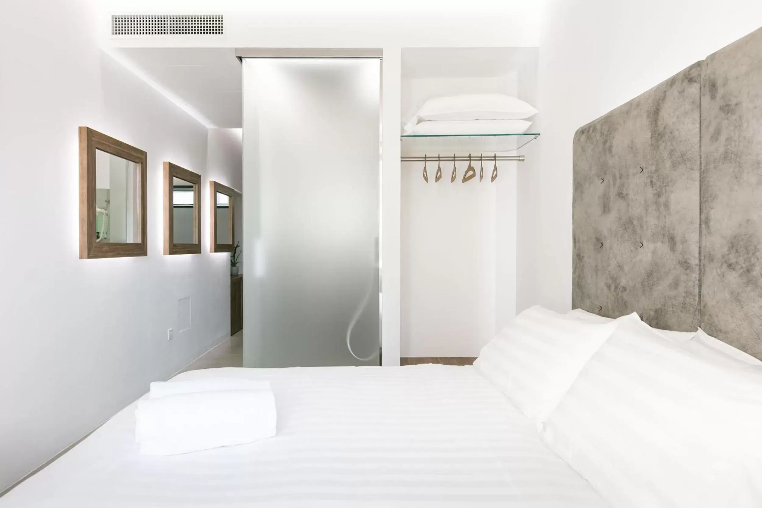 Bed in DOMUS CAVOUR Rooms&Suites