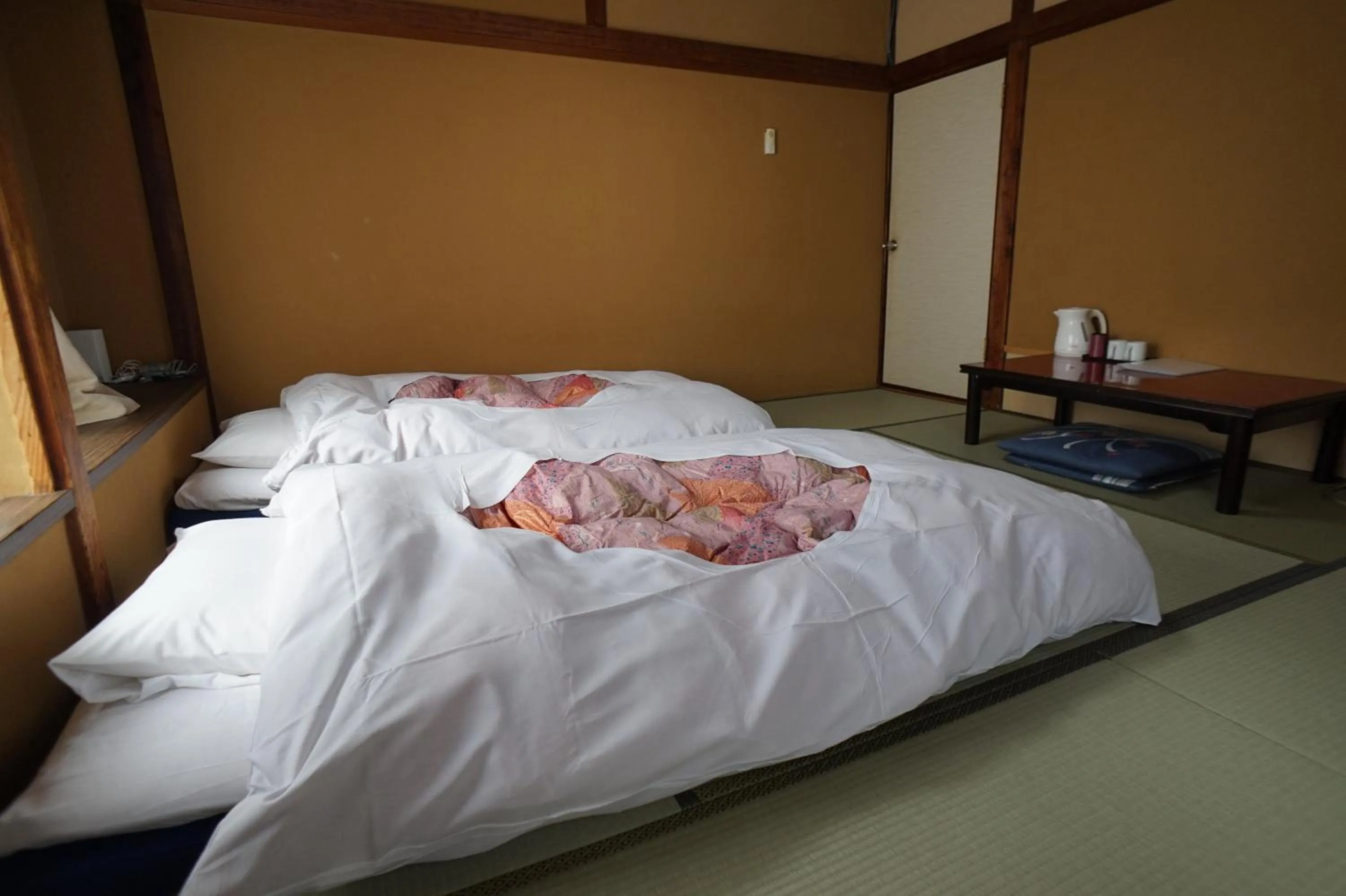 Photo of the whole room, Bed in Ryokan Katsutaro