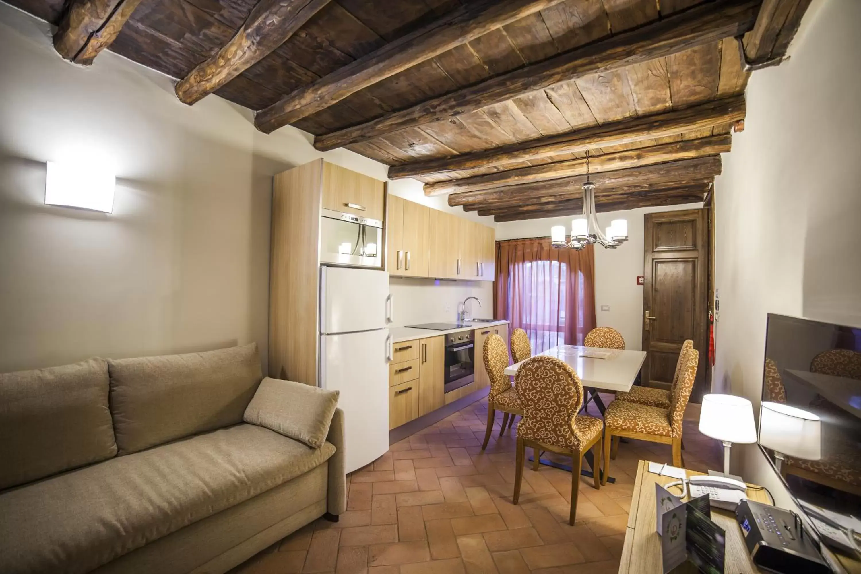 Kitchen or kitchenette, Seating Area in Palazzo Catalani Resort
