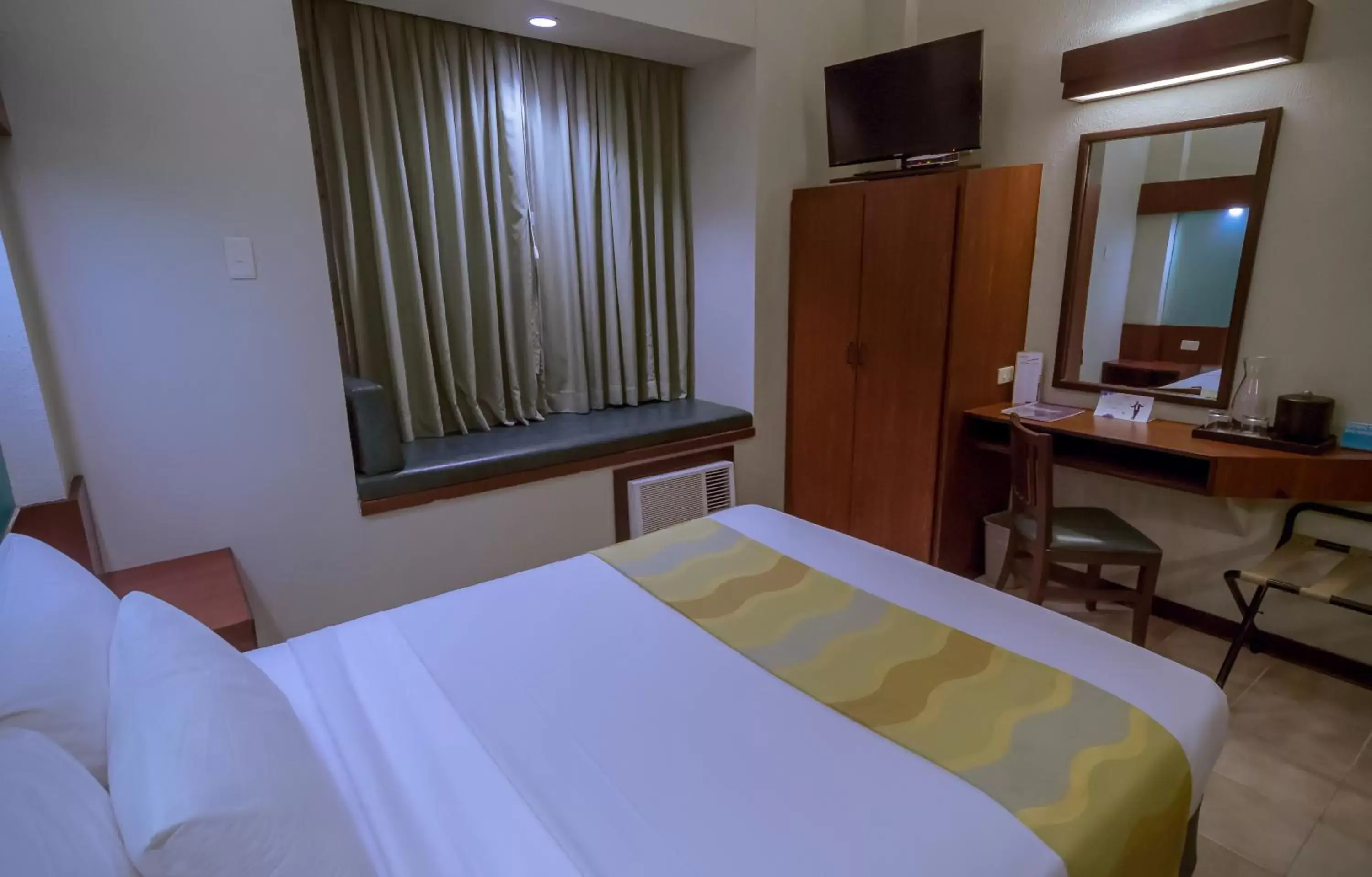 Photo of the whole room, Bed in Microtel by Wyndham Tarlac