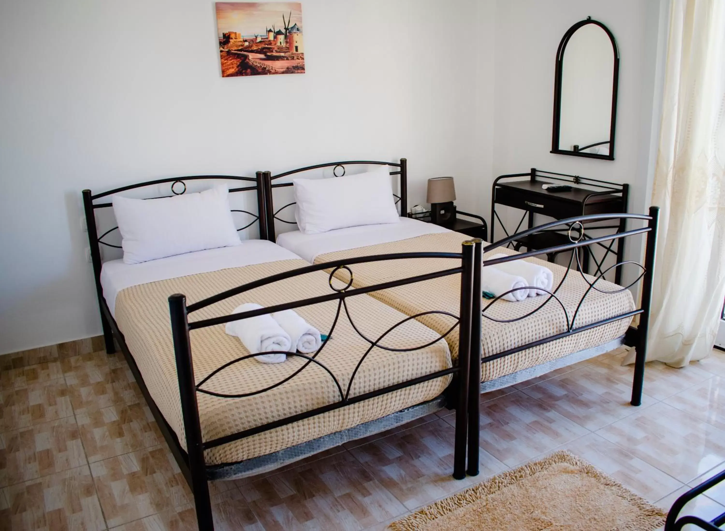 Bed in Nikolakakis Rooms Lavrio